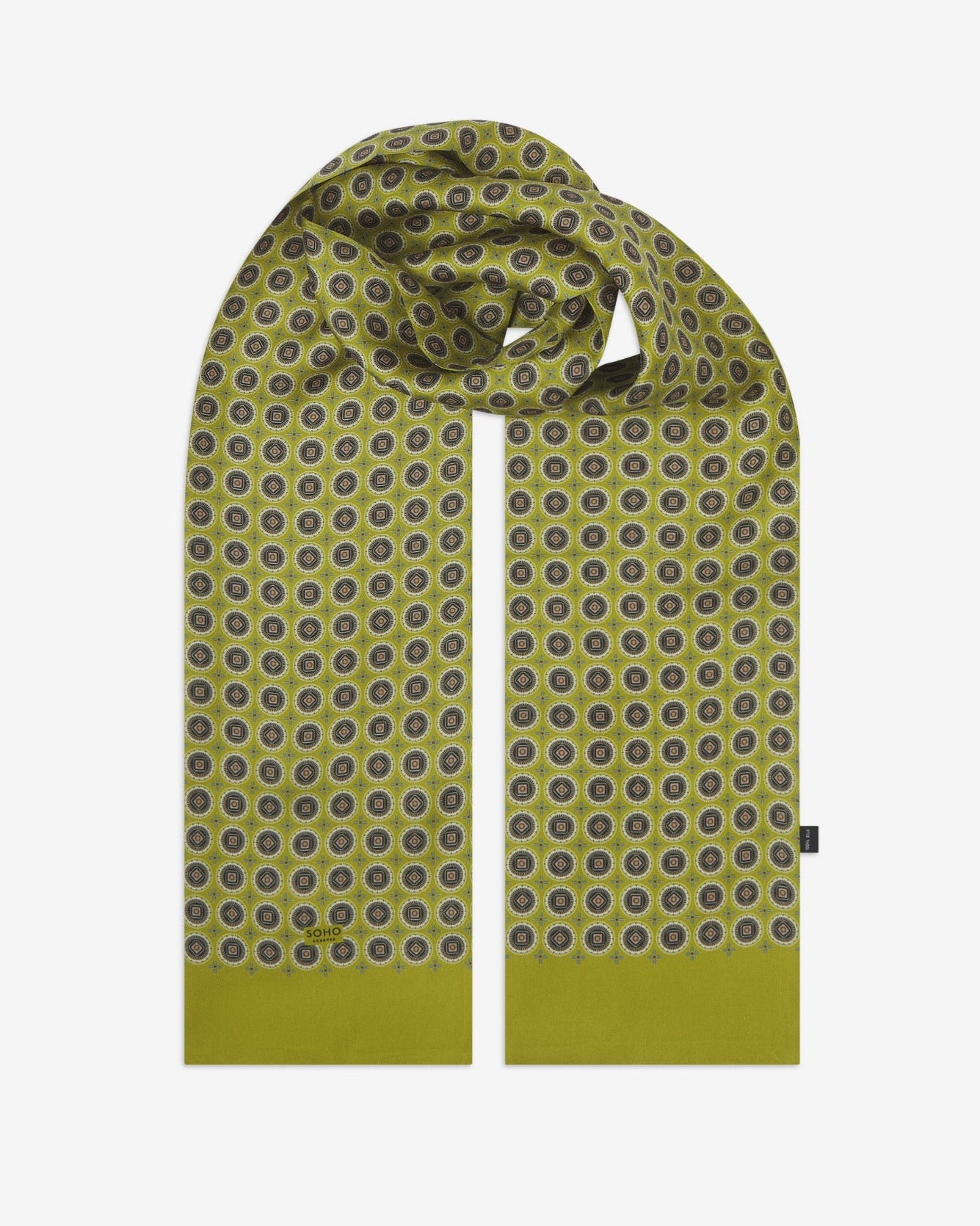 The 'Bellingham Lime' silk scarf looped with both ends parallel to effectively display the full intricate geometric circular pattern against the sheen of the fine silk material.