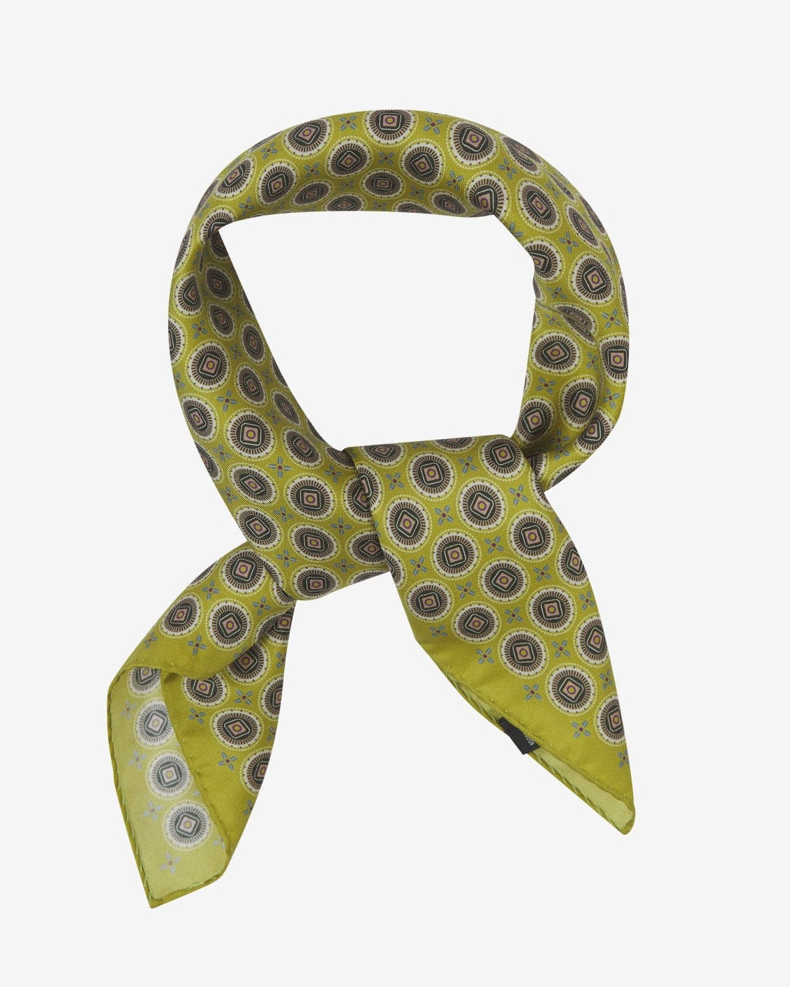 The 'Bellingham Lime' neckerchief looped and knotted, presenting the intricate geometric circular pattern against the sheen of the fine silk material.