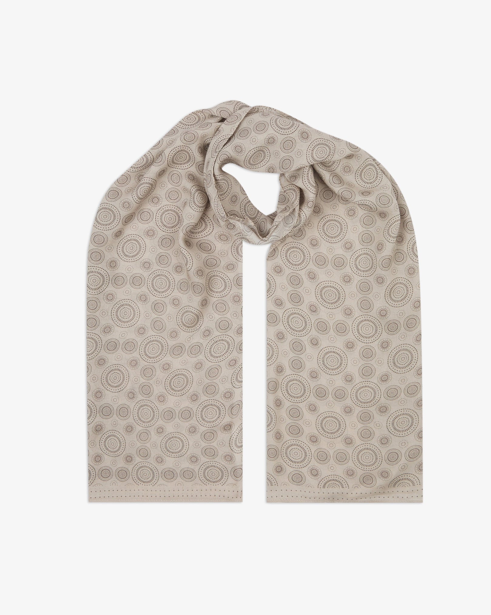 The 'Circles' cream bohemian wide scarf looped with both ends parallel, showcasing concentric Op art-inspired disc motifs in dark grey on a pale cream background across the soft modal and wool blend fabric.