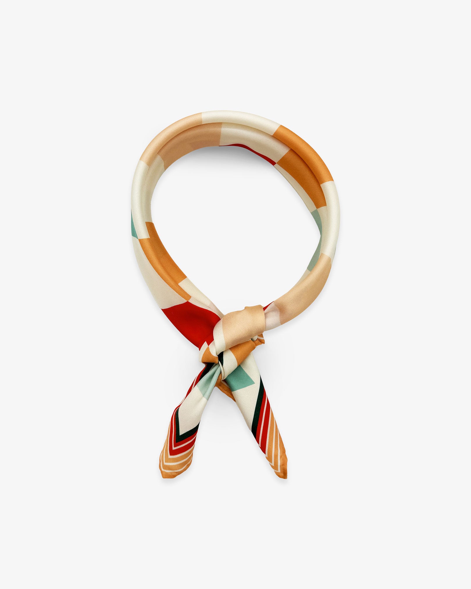 The 'Diamonds' silk neckerchief from SOHO Scarves knotted and looped against a white background.