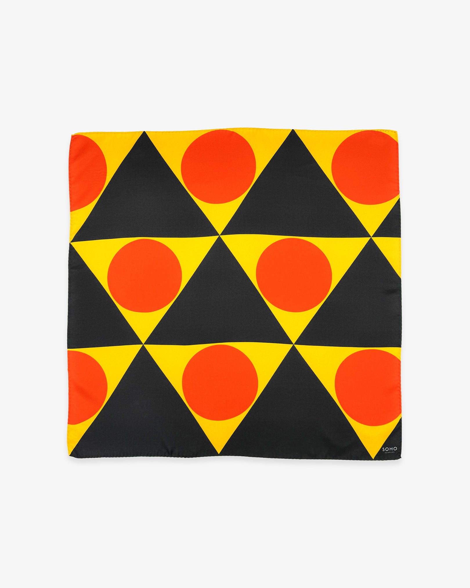 Unfolded 'Dresden' silk neckerchief, showing the triangular shapes of yellow and dark grey with orange discs.