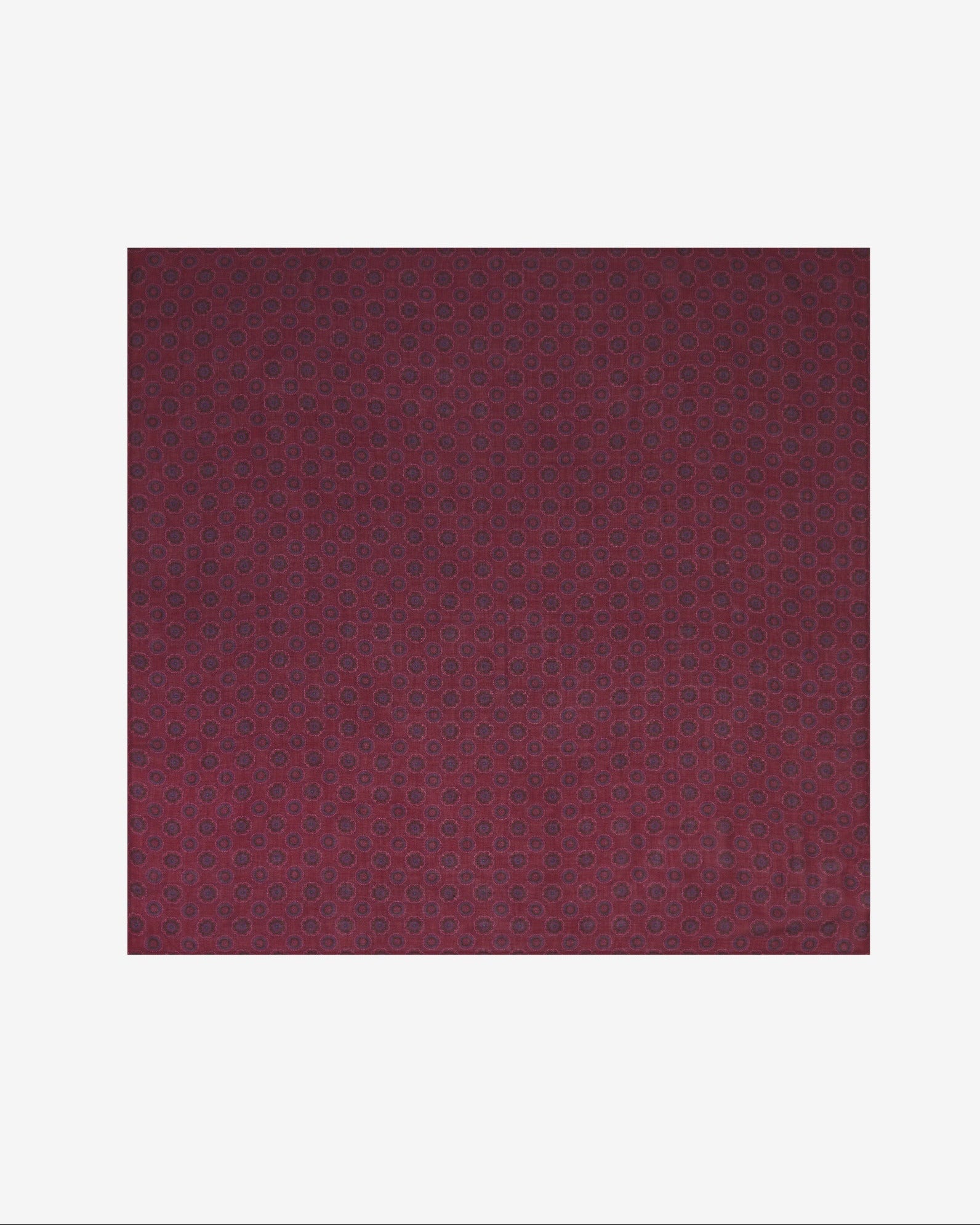 A flat, unfolded view of 'The Seattle' bandana. Clearly showing the intricate, linear floral and circular patterns in red and blue on a maroon background.