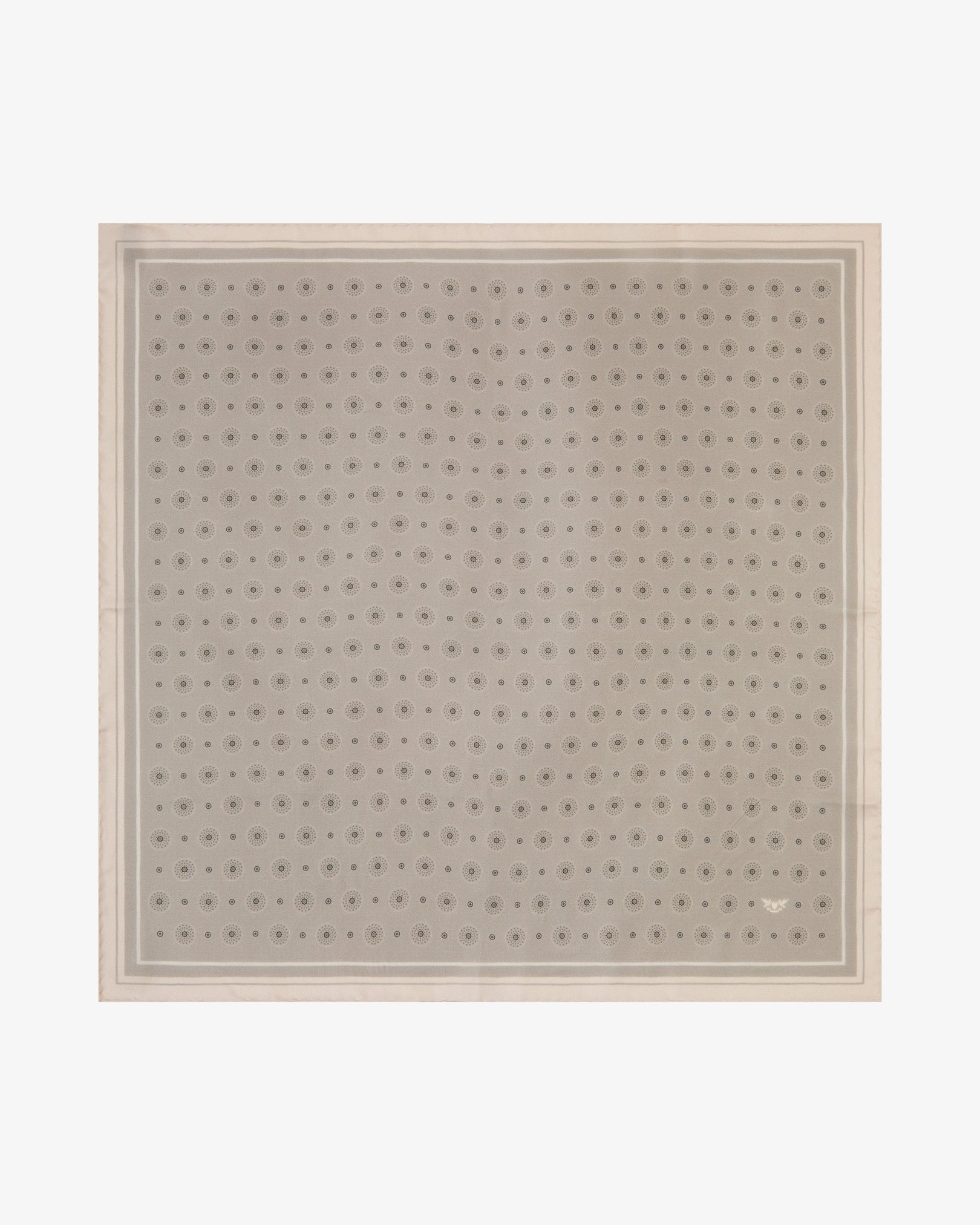 Fully unfolded 'Islington' silk neckerchief, showcasing a repeating tonal geometric circle and sunburst pattern on a warm greige-stone background, framed by a slim stone inner border and a wide cream outer border.