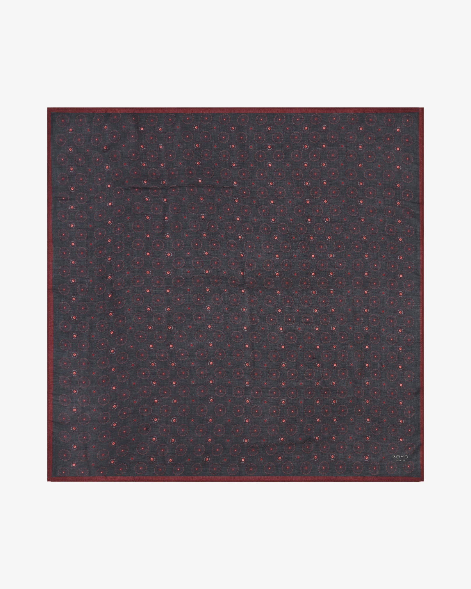 Fully unfolded 'Seattle Good Fortune' silk bandana, clearly displaying the red celestial-like patterns against a black background.