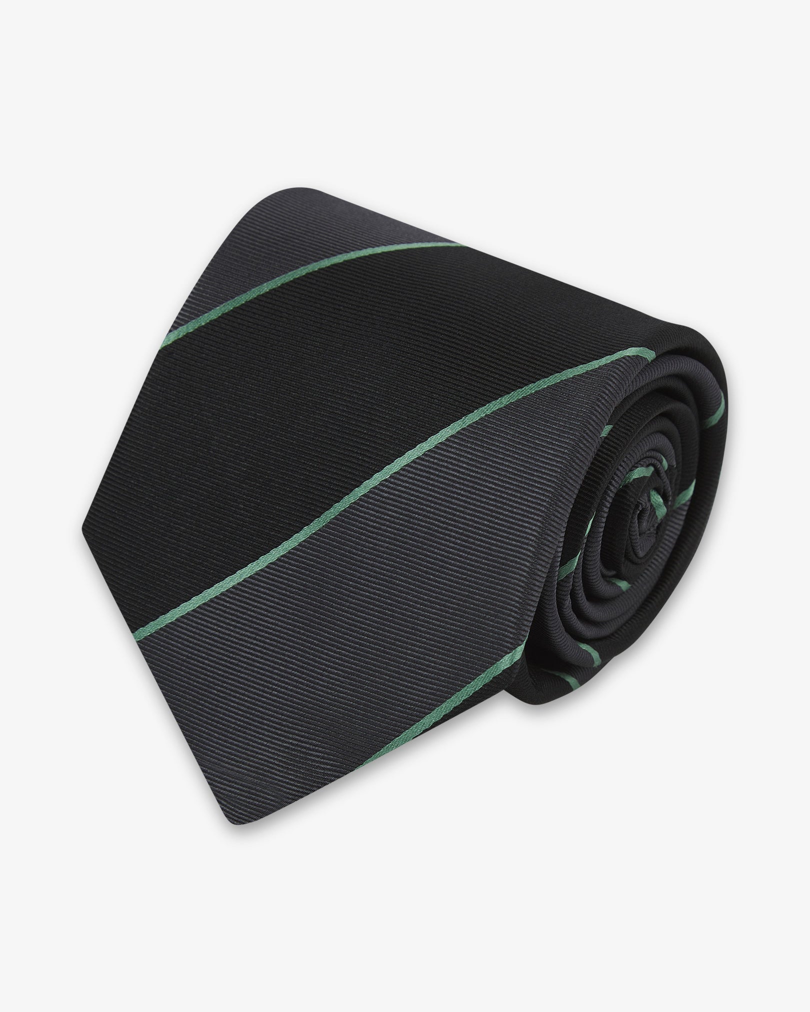 Focus on the tip of the 'Jarrett Gardenia' silk neck tie. Showing the grey and black bands and the remaining tie length neatly coiled.
