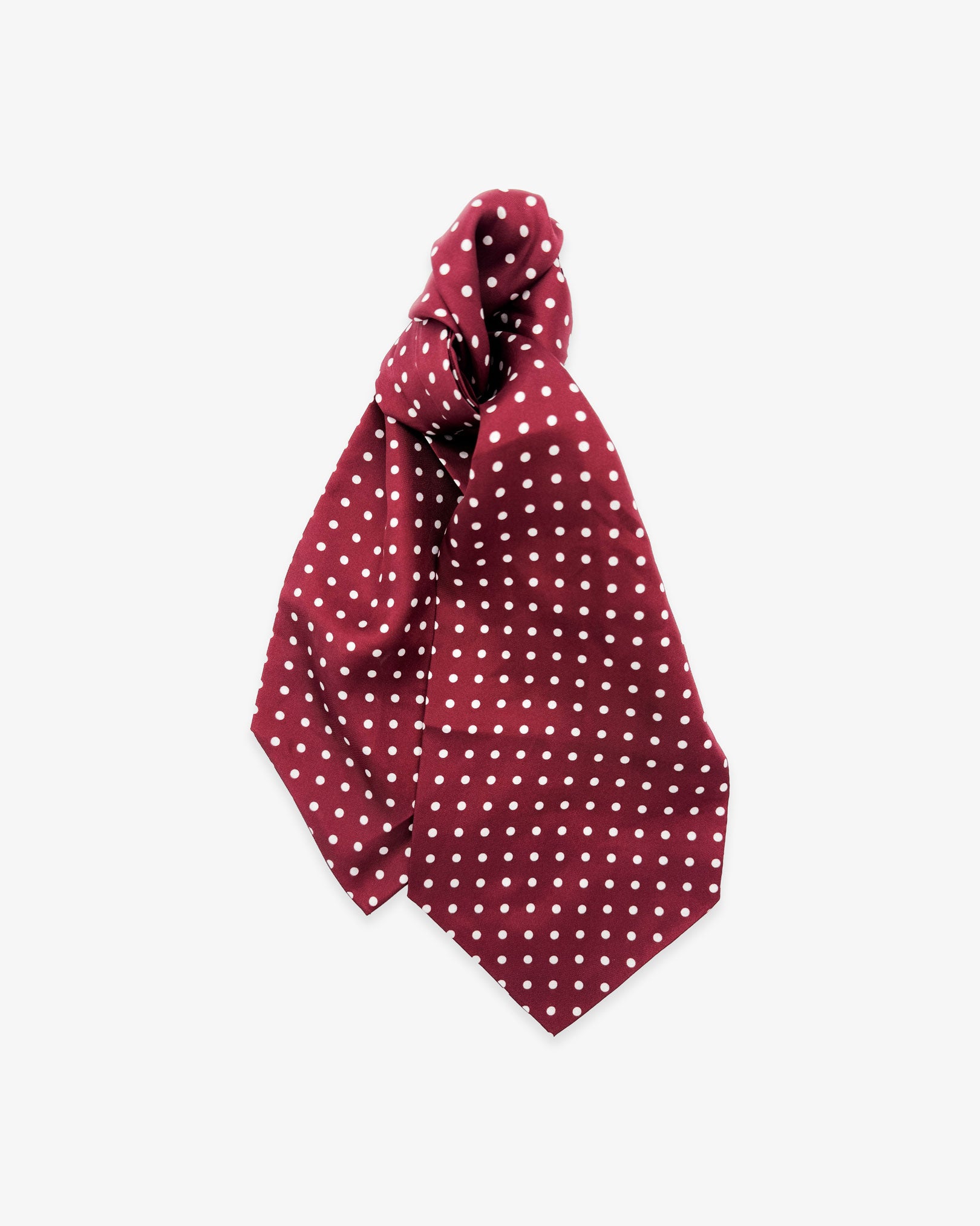 Entire view of 'The Sapporo' double Ascot tie with wide ends at the bottom and clear view of the white polka dots on a maroon background.