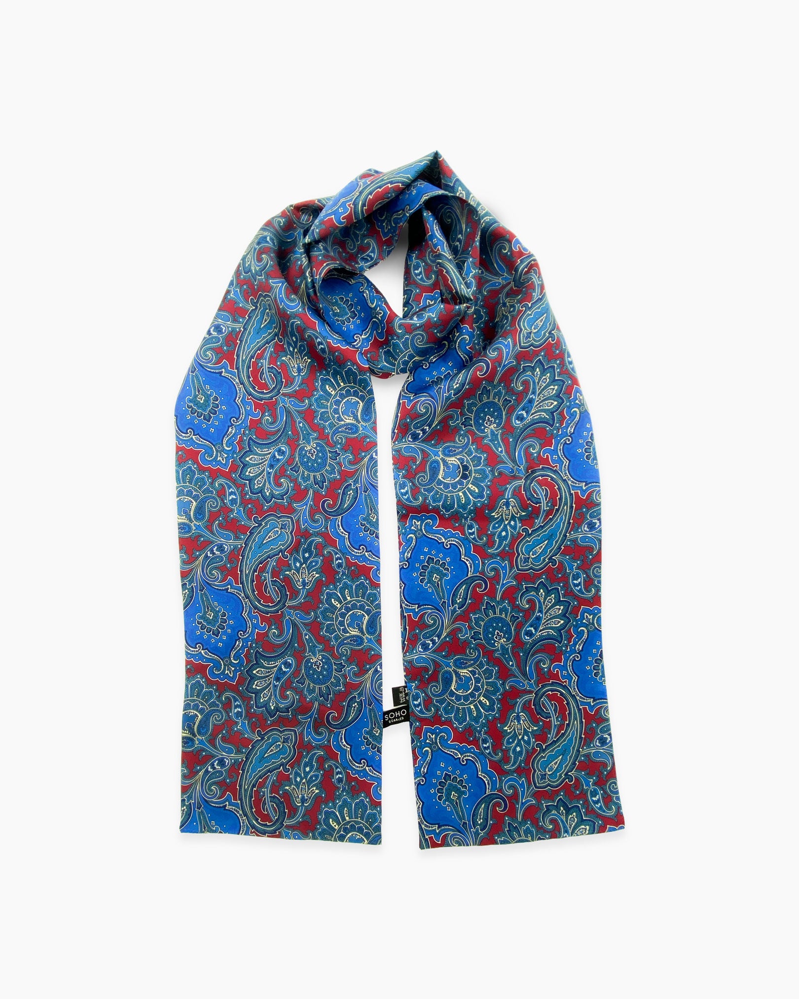 Looped view of the 'Dean' silk scarf, clearly showing the burgundy and blue patterns and a matching 3-inch fringe.