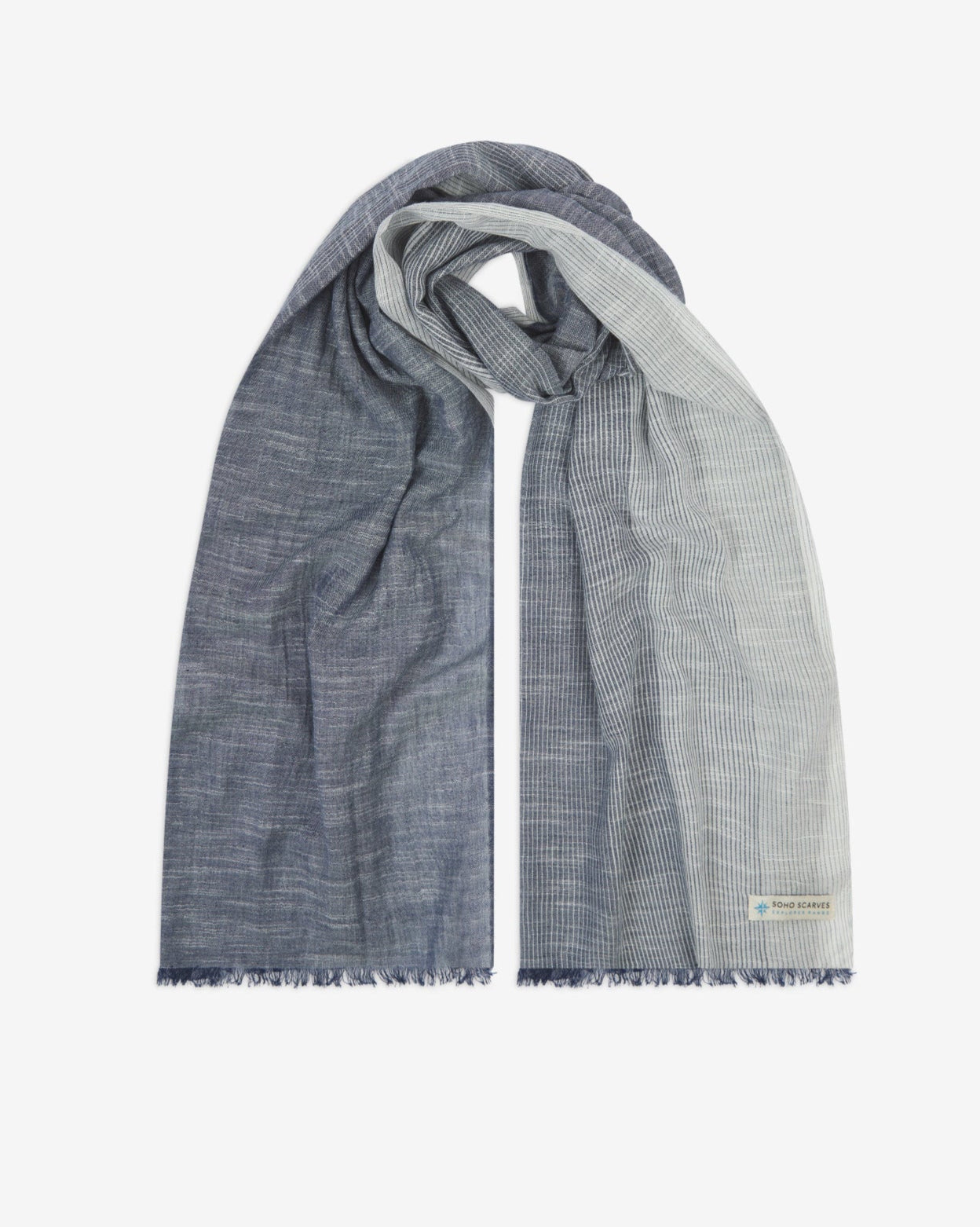 The 'Hargreaves' cotton marl scarf, looped in middle with both ends parallel. Displaying the gradient pattern of grey-blue to white and the SOHO Scarves Explorer Range branding logo in the bottom-right.