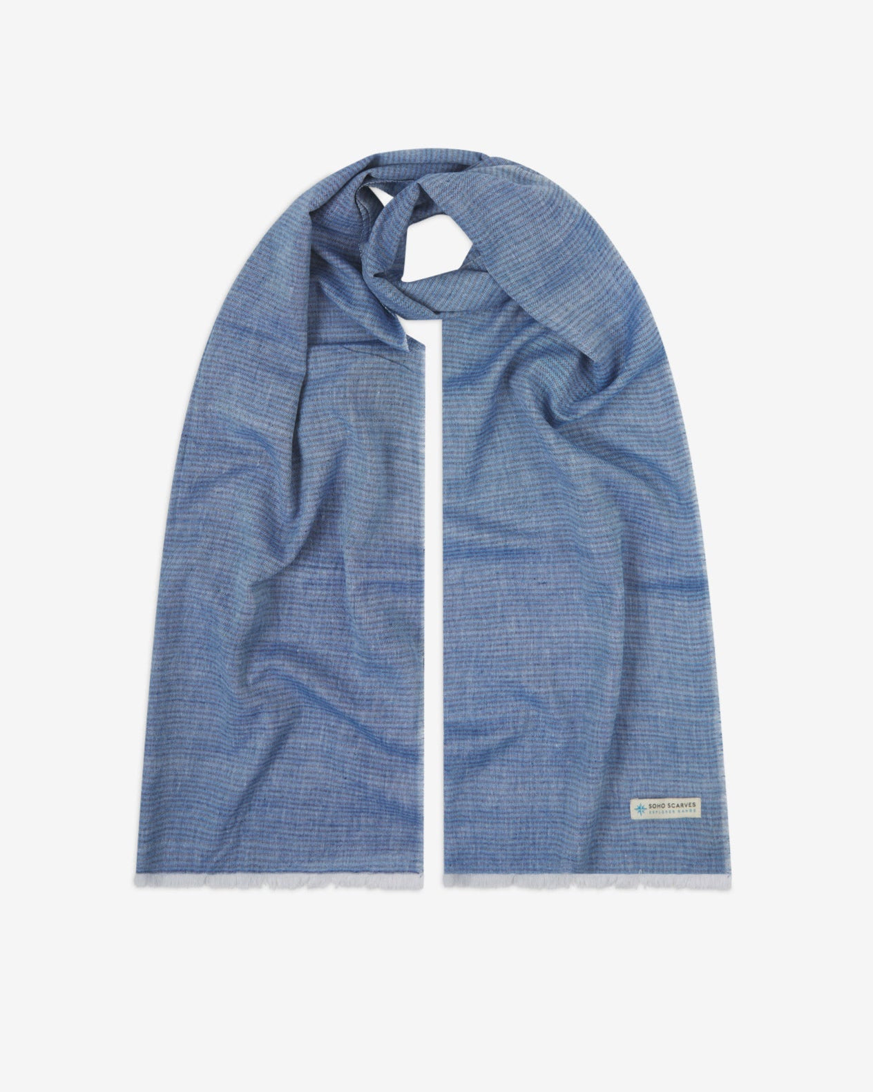 The 'MacArthur' cotton heathered scarf, looped in middle with both ends parallel. Displaying the blue heathered fabric and the SOHO Scarves Explorer Range branding logo in the bottom-right.