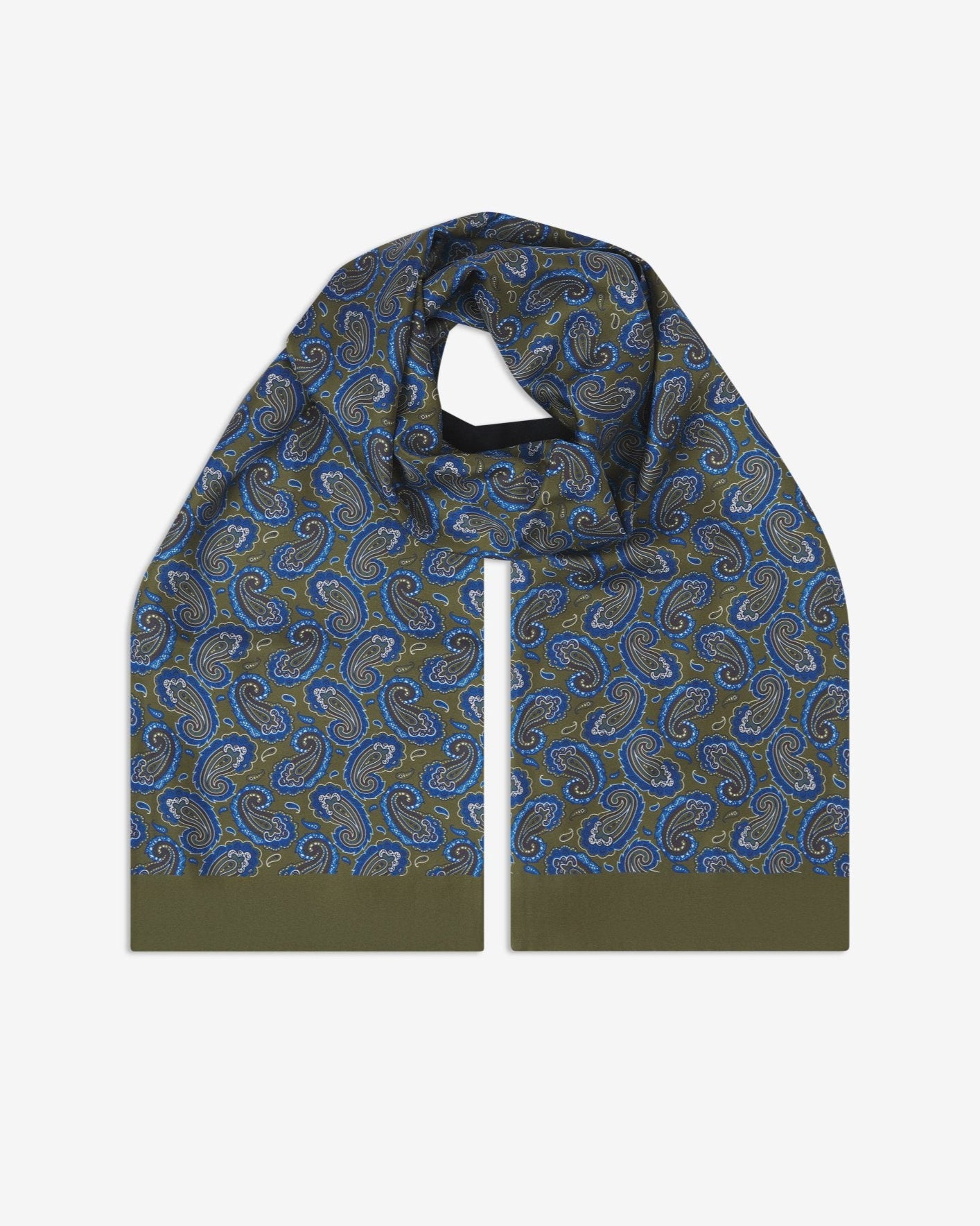 The Malibu wool-backed silk scarf. Unravelled and looped in the middle, showing the length, width and paisley pattern on silk.
