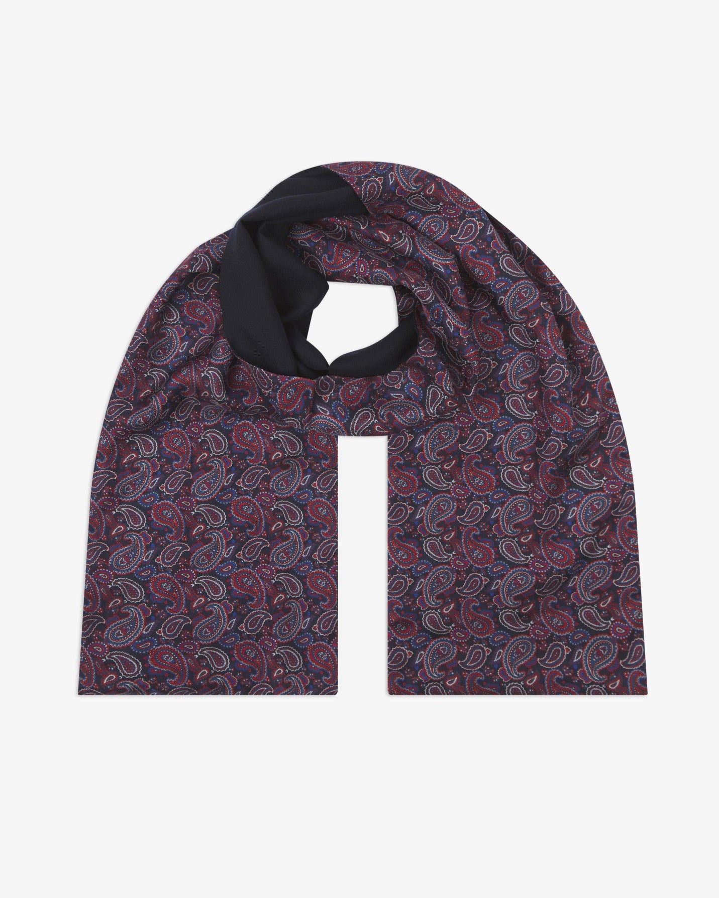 The Oakland wool-backed silk scarf. Unravelled and looped in the middle, showing the length, width, pattern on silk and the fine woollen underside.