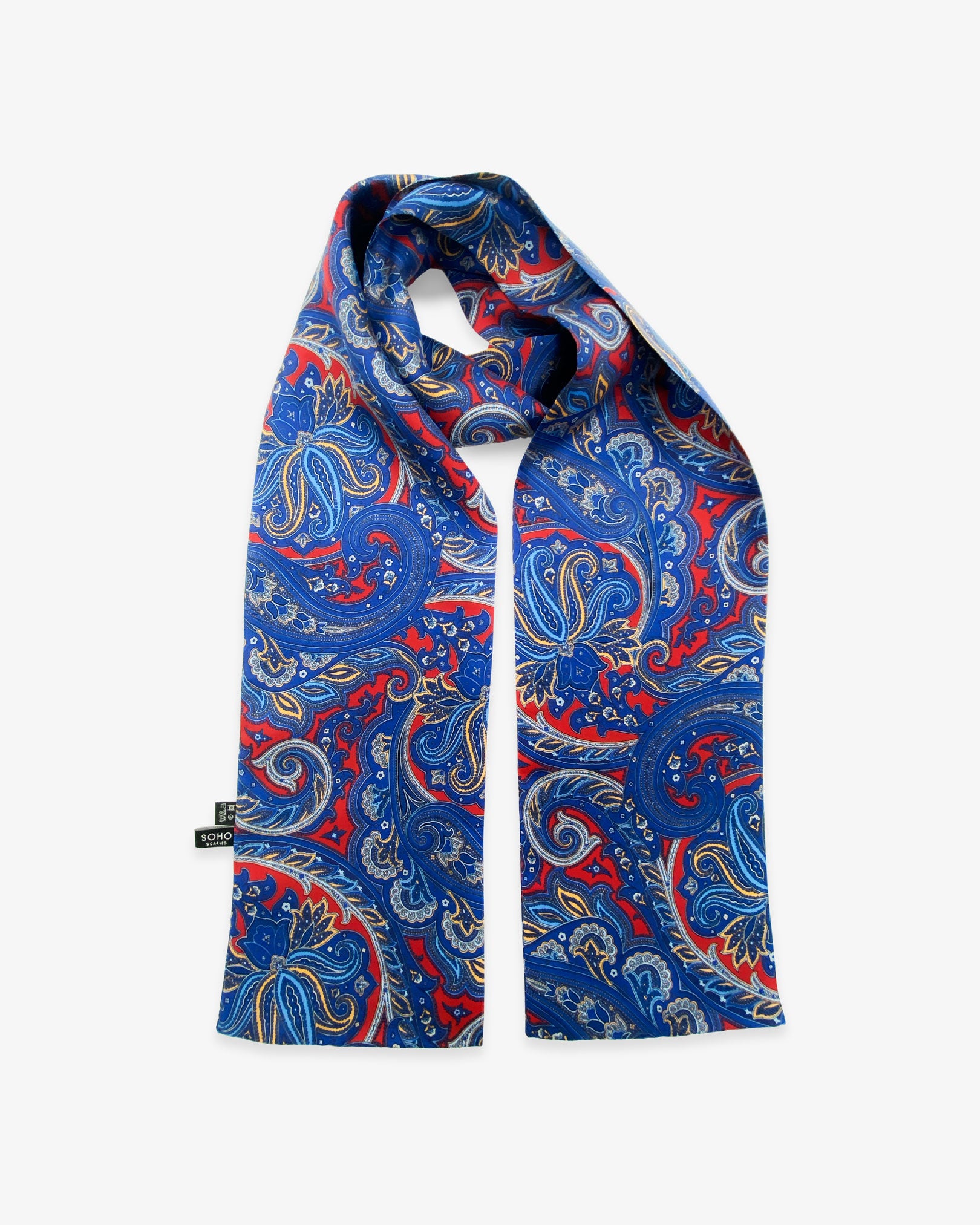 The Oxford pure silk paisley scarf looped in middle with both ends parallel showing the navy-blue paisley patterns on a deep-red ground with matching 3-inch fringe.