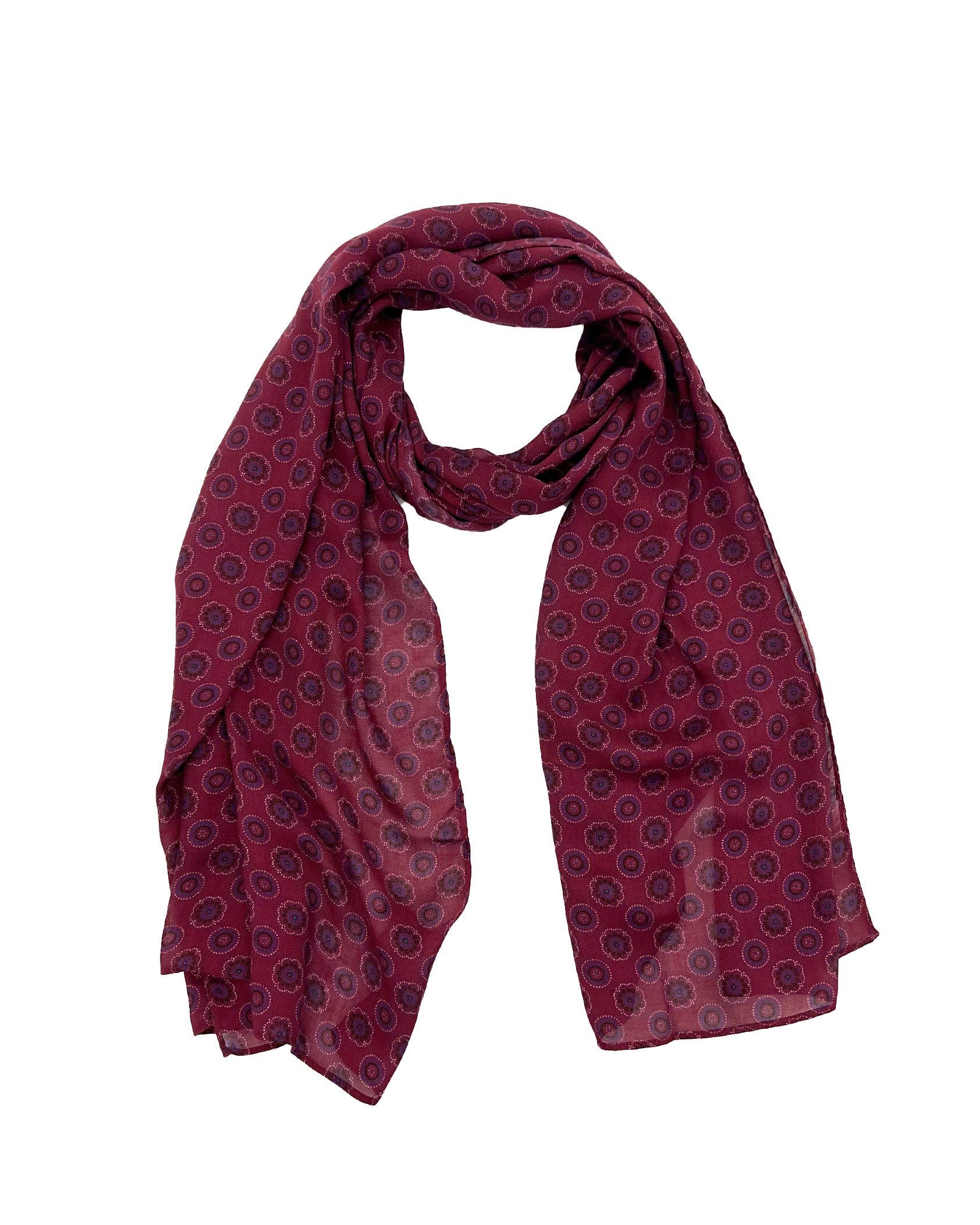 The Seattle wide scarf unravelled and looped in the middle, demonstrating the considerable length and showing the floral and circular patterns on a maroon ground.