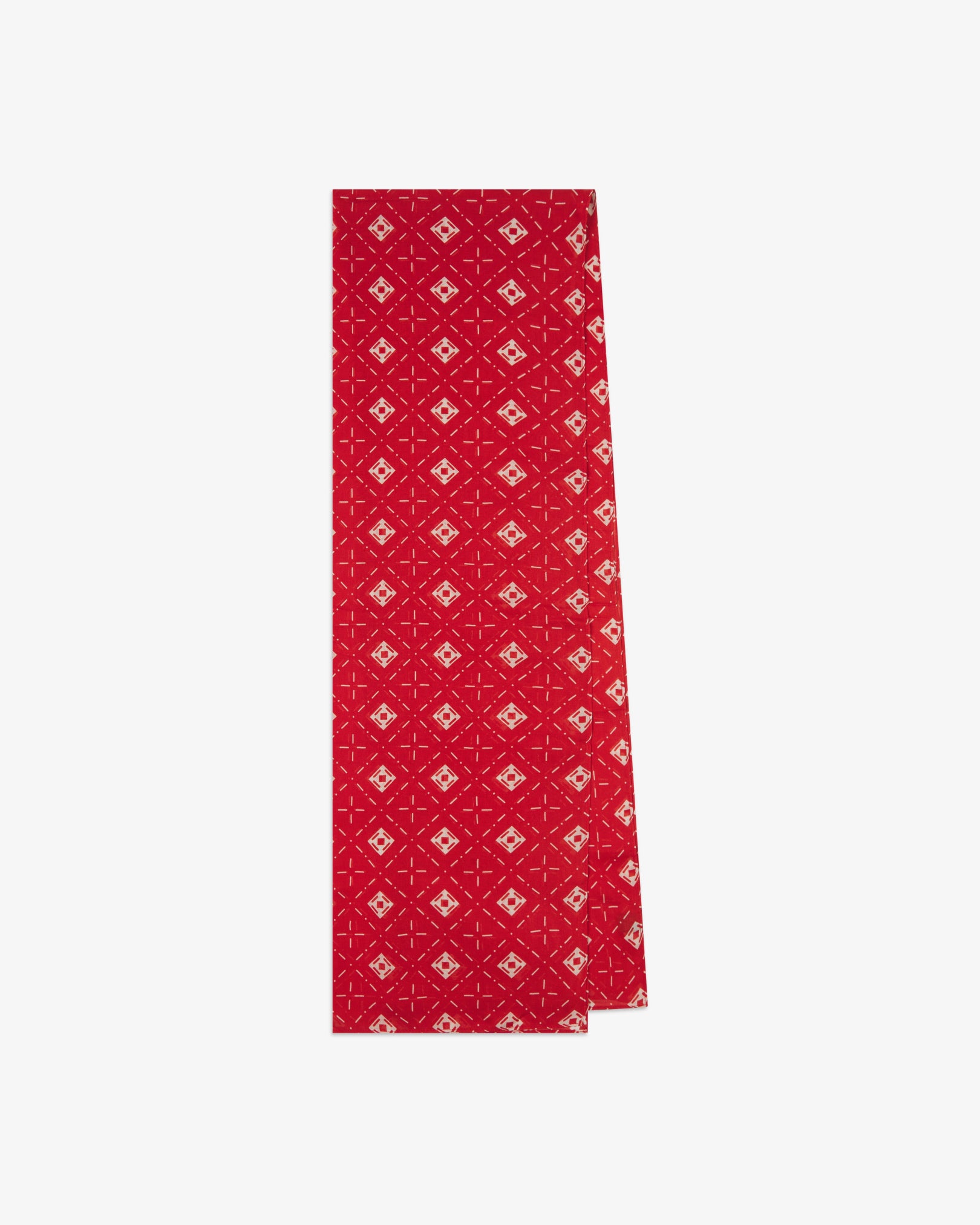 The 'Diamonds' red bohemian wide scarf from SOHO Scarves folded and presented vertically to show the full dimensions and repeating diamond mosaic pattern of white lozenges and crosshair motifs on a bright red background.