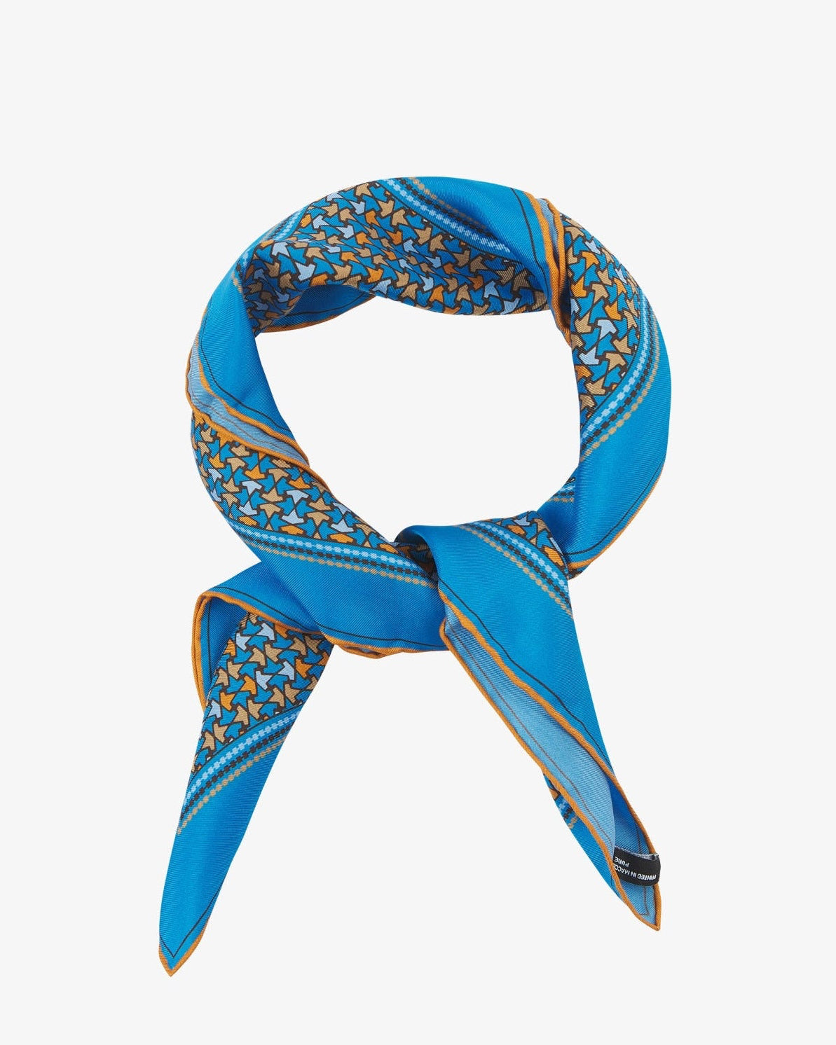 The 'Richmond' neckerchief looped and knotted, featuring vivid azure silk bordered with a tessellated leaf pattern in orange, gold, and sky blue.