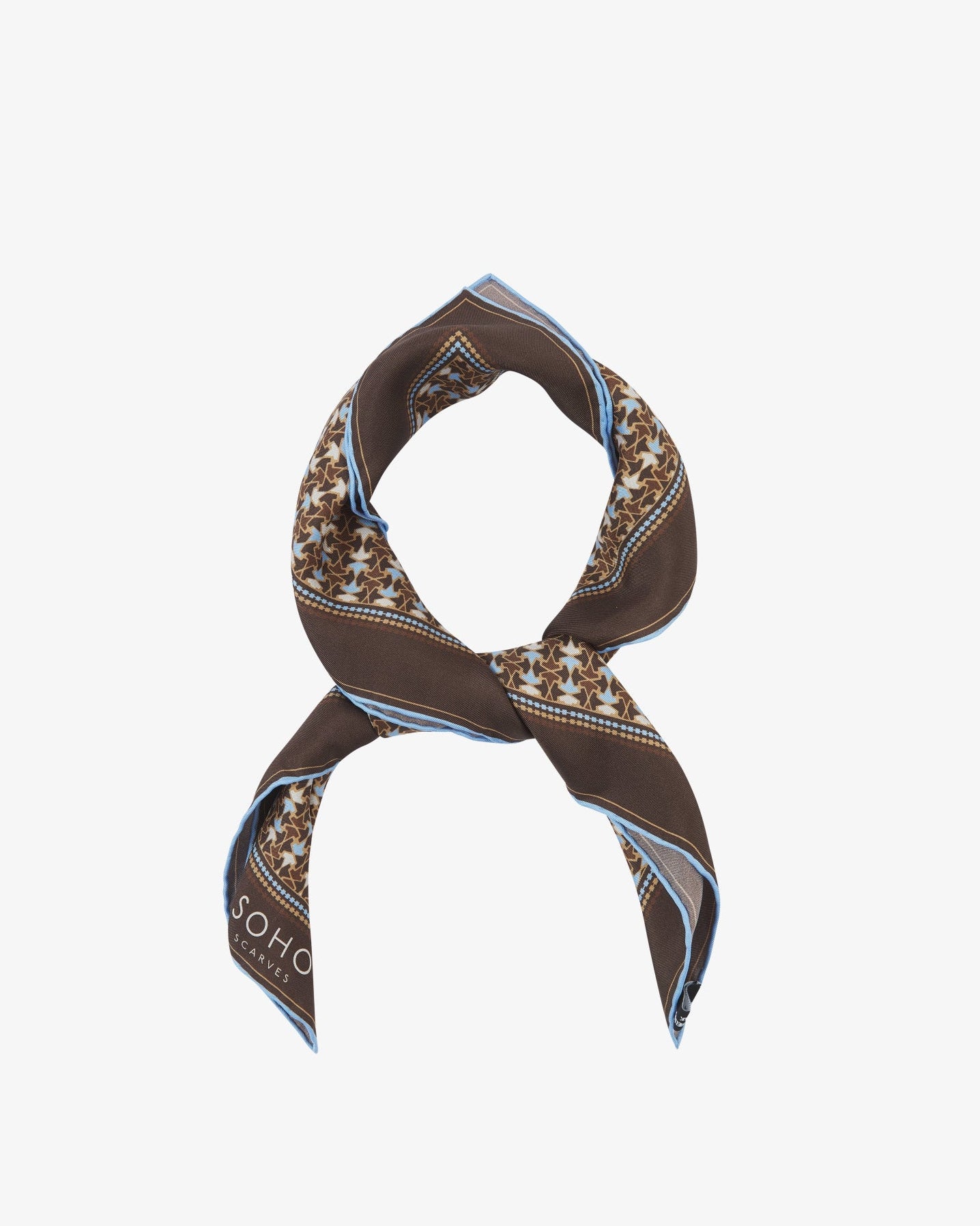 The 'Richmond' neckerchief looped and knotted, featuring warm chestnut silk bordered with a tessellated leaf pattern in soft blue and cream.