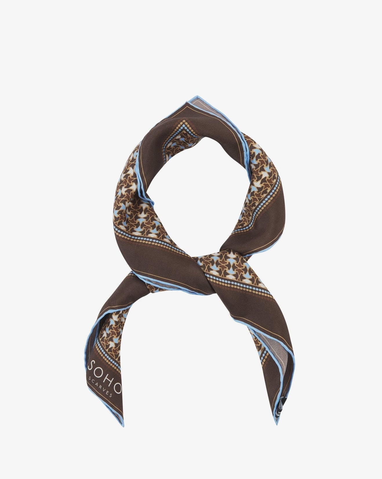 The 'Richmond' neckerchief looped and knotted, featuring warm chestnut silk bordered with a tessellated leaf pattern in soft blue and cream.