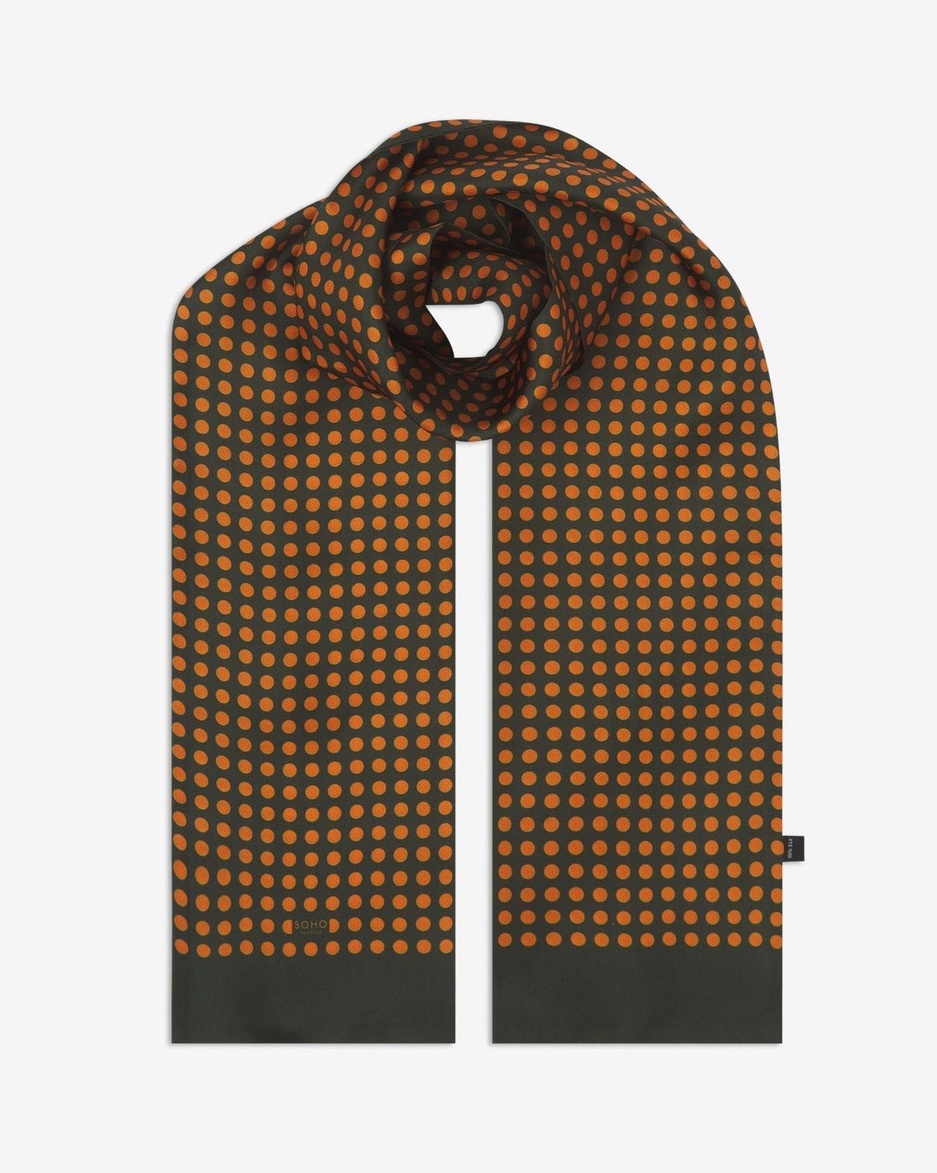 The 'Skytree Olive' silk scarf looped with both ends parallel to effectively display the orange disc pattern against the sheen of the fine silk material.