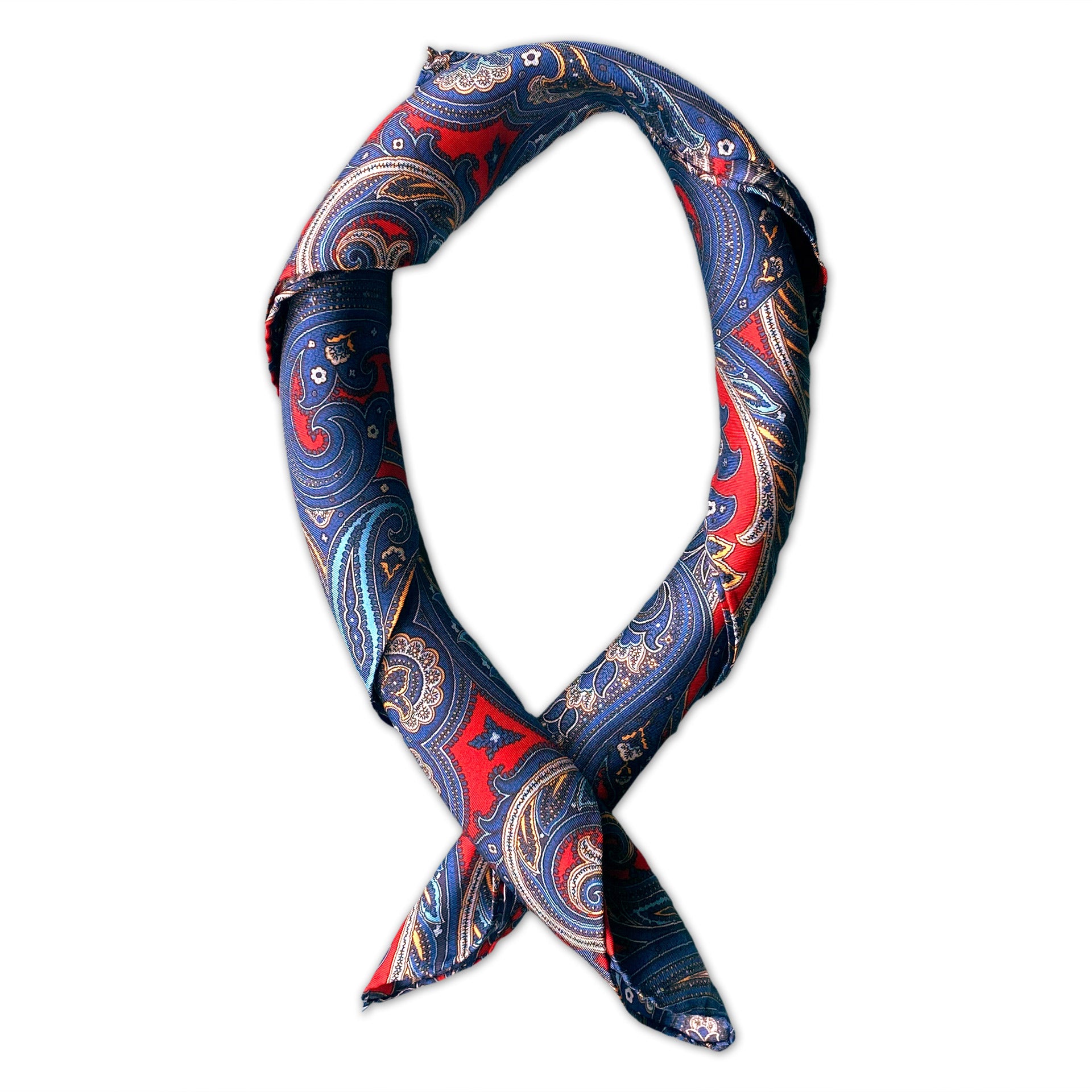 Square scarf rolled into a loop, showing the sheen of the fabric and the striking deep-red and blue contrasts.