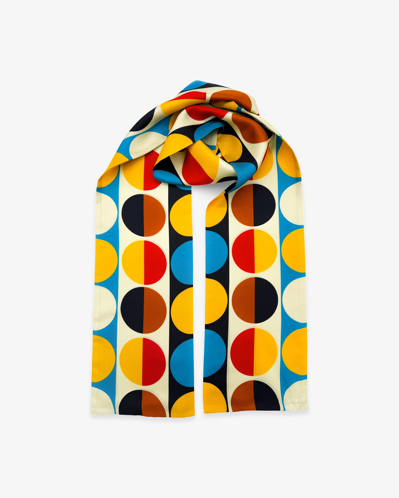 The 'Weimar' Bauhaus-inspired silk scarf looped with both ends parallel to effectively display the full repeat pattern of multicoloured semicircular discs.