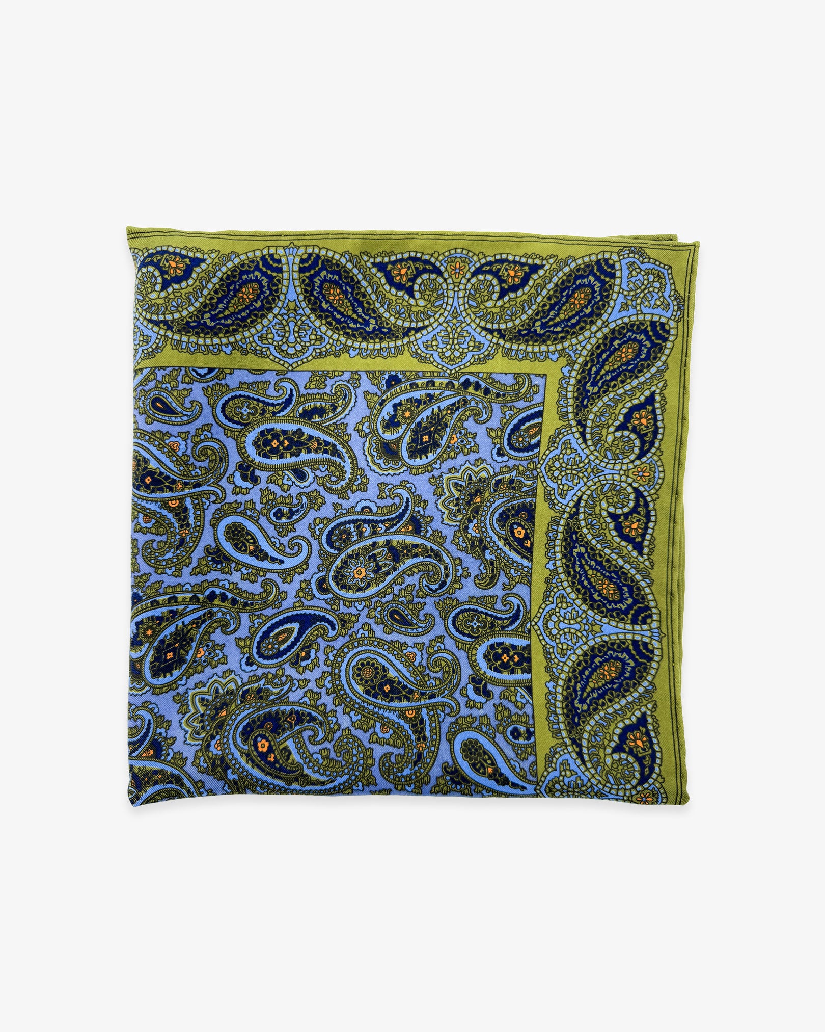 The 'Acton' pocket square from SOHO Scarves Madder silk collection. Folded into a quarter, showing the intricate inner and outer paisley decoration in violet and lime green.
