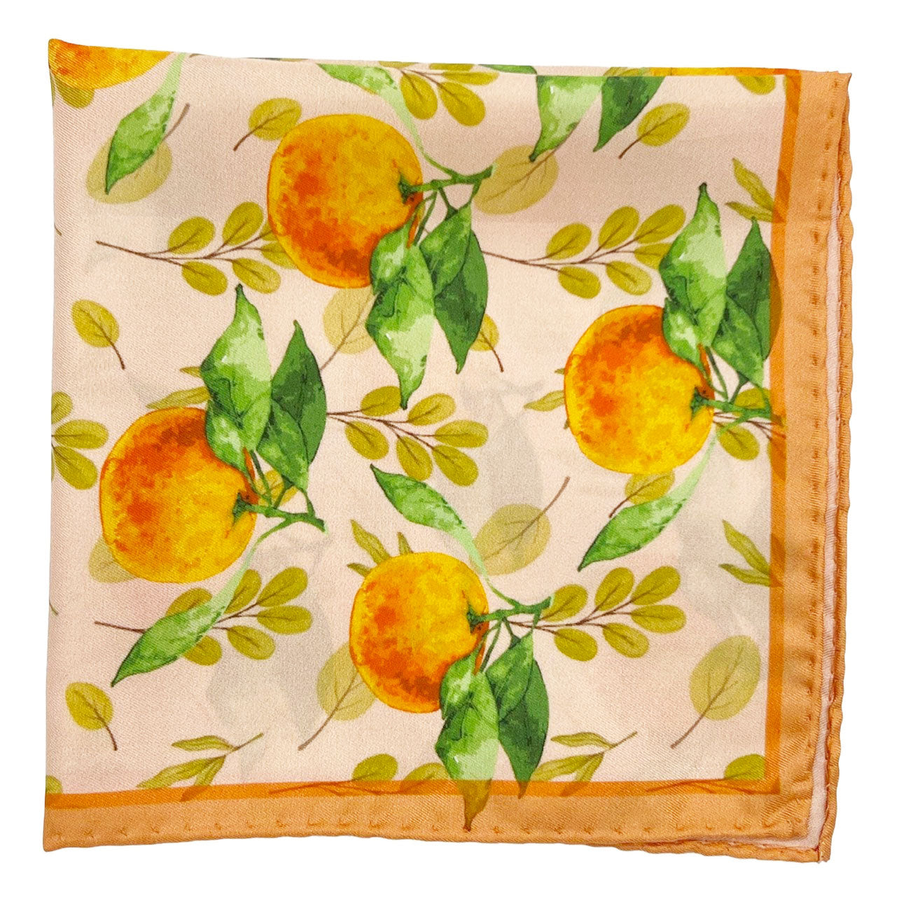 The 'Aire' silk pocket square from SOHO Scarves folded into a quarter, showing the orange motif, framed on two sides by a peach-coloured border.