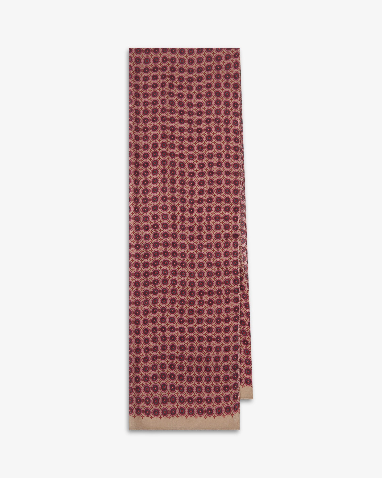 The Bellingham 'Good Fortune' bohemian wide scarf folded and presented vertically to show the full dimensions and repeating concentric circular pattern in pink, red and maroon on a subtle cream background.