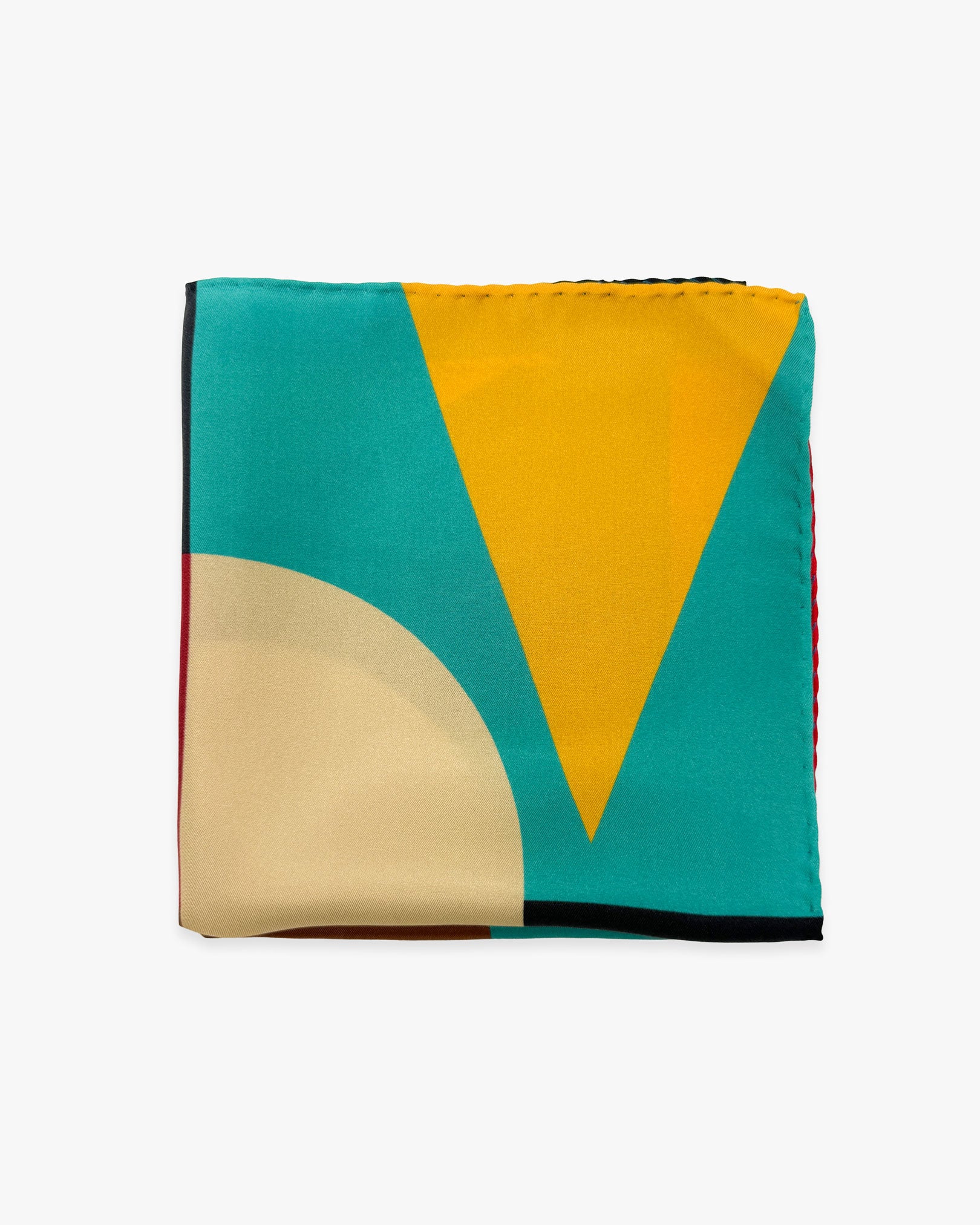The 'Berlin' silk pocket square from SOHO Scarves folded into a quarter, showing a portion of the geometric and bauhaus-inspired pattern.
