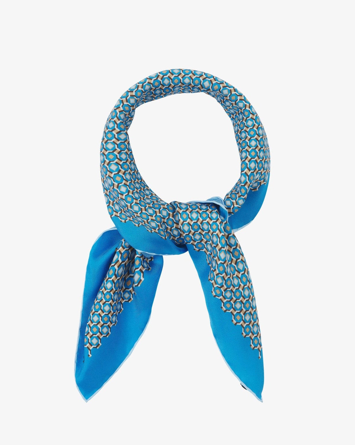 The 'Berwick' neckerchief looped and knotted, revealing the turquoise, stone-grey, and gold geometric pattern shimmering on the smooth silk surface.
