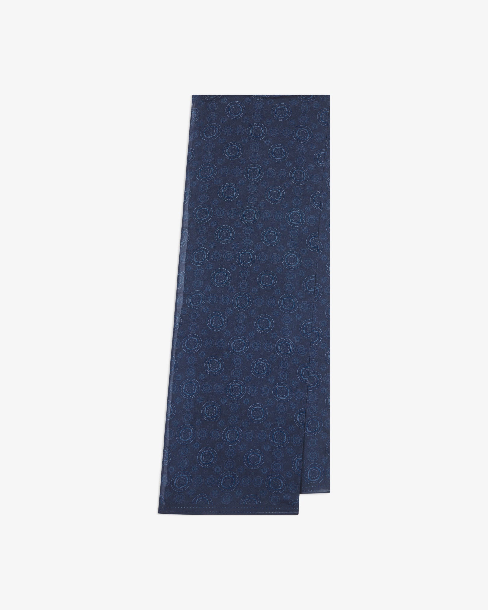 The 'Circles' blue bohemian wide scarf from SOHO Scarves folded and presented vertically to show the full dimensions and repeating concentric Op art-inspired disc pattern in light blue on a dark blue background.