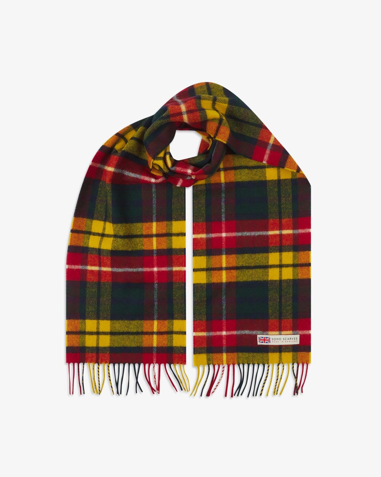 The 'Highlands tartan Buchanan' scarf, looped in middle with both ends parallel showing the red, yellow, and navy patterns, fringing and SOHO Scarves logo with Union Jack motif.