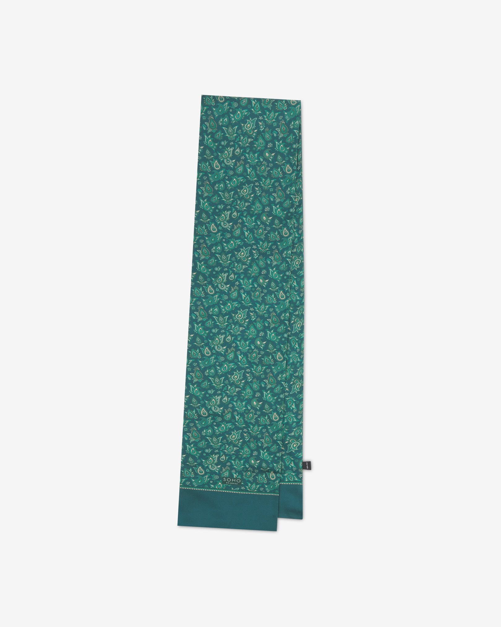 The 'Buttermere' emerald-green silk scarf folded and presented vertically illustrating the full scarf dimensions and dark green borders.