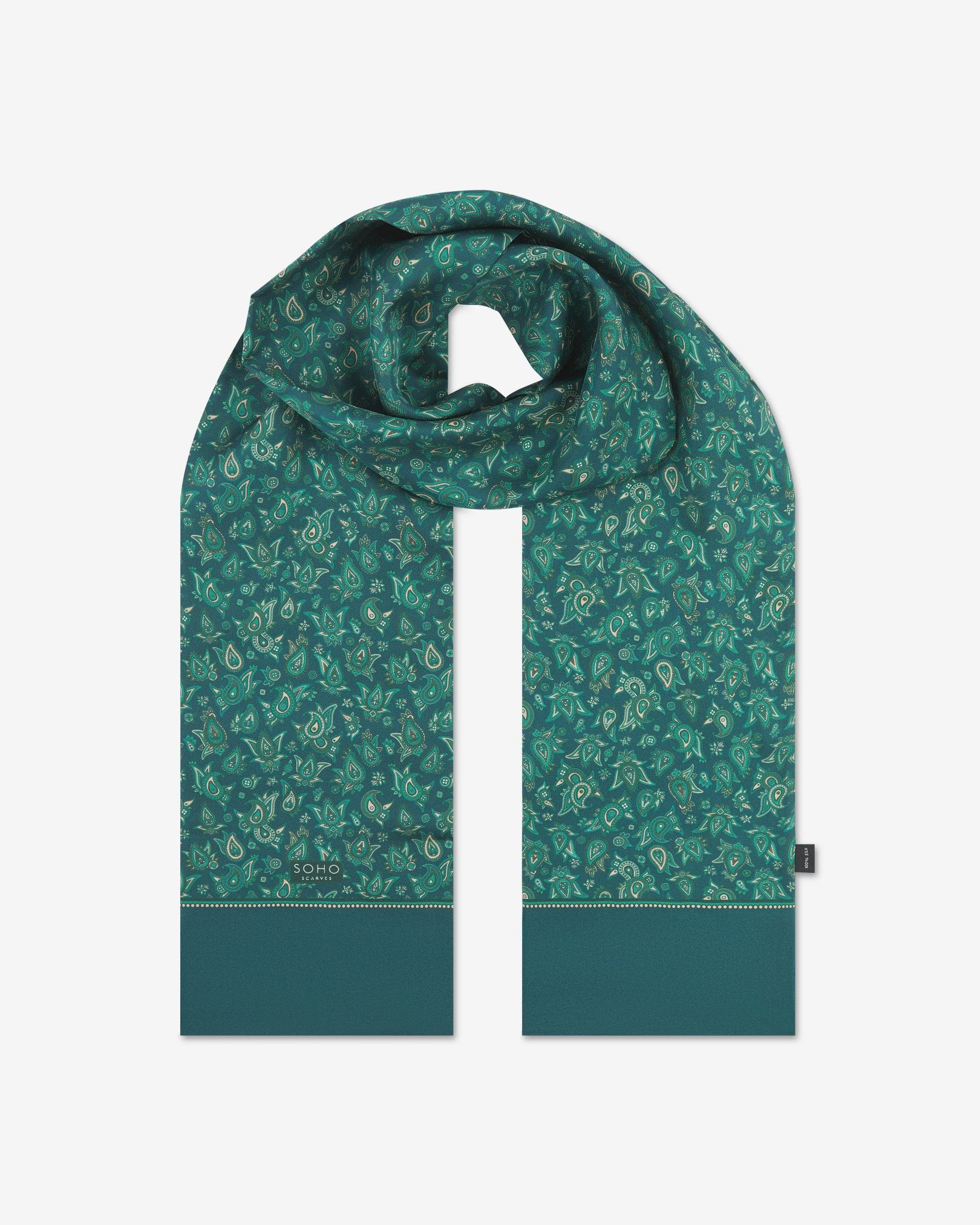 The 'Buttermere' emerald-green silk scarf looped with both ends parallel to effectively display the full repeat pattern of green and salmon pink paisley patterns.