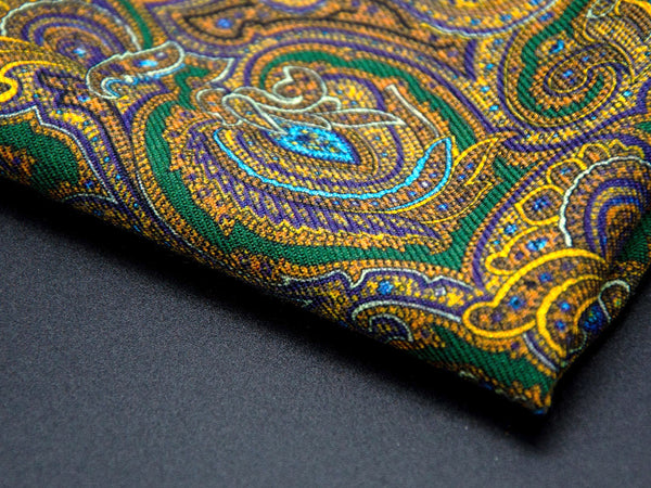 Focus on a corner point of 'The Kingly' paisley patterned square, showing the fine wool weave.