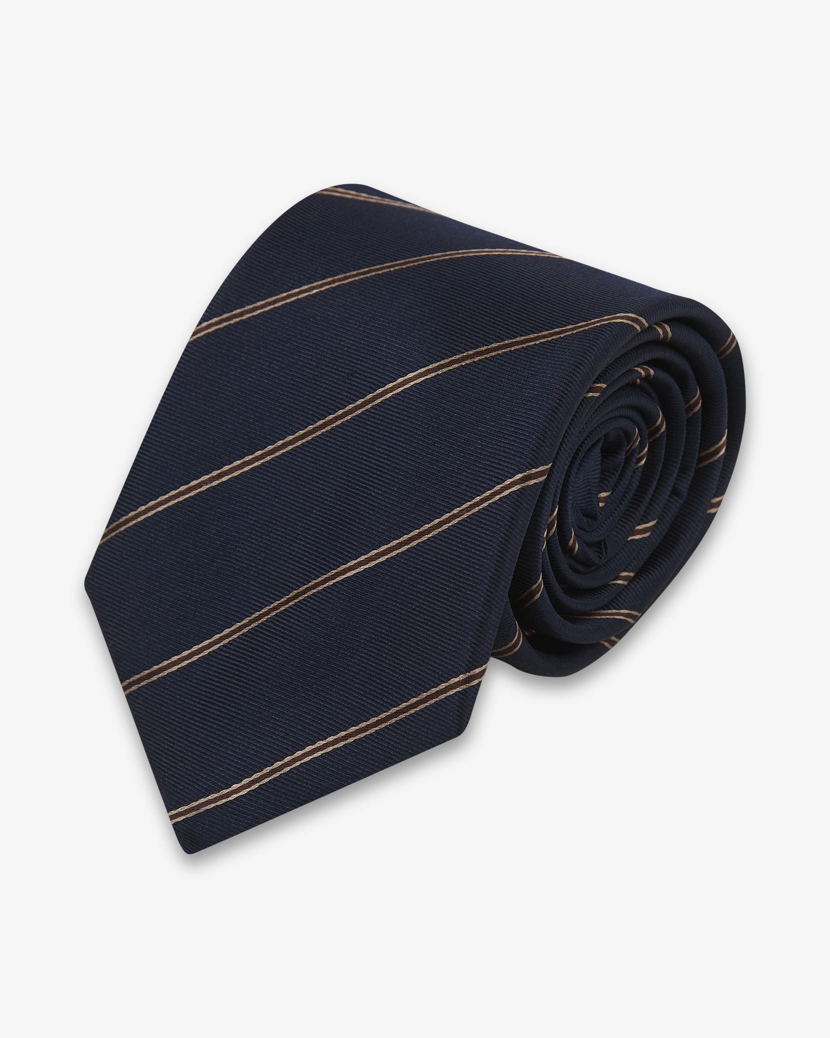 Focus on the tip of the 'Coltraine Mahogany Haze' silk neck tie. Showing the gold and brown stripes and the remaining tie length neatly coiled.