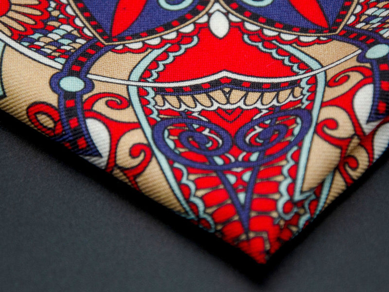 Close-up of a quarter point of the 'Kopli' pocket square, providing clear view of the wool weave and an even closer look at a paisley segment.