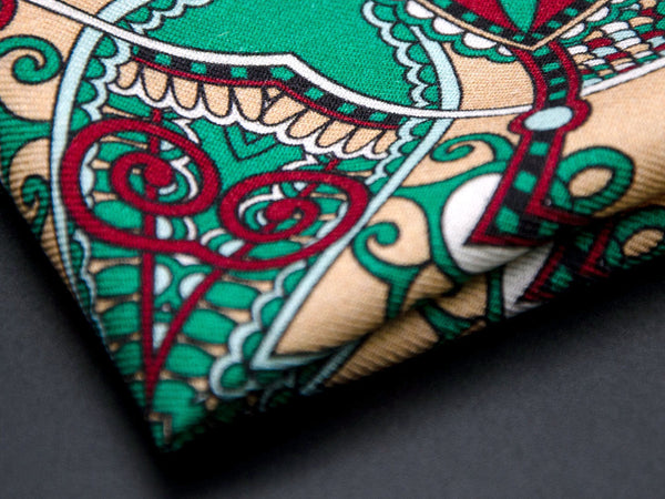 Close-up of a quarter point of the 'Mustamae' pocket square, providing clear view of the wool weave and an even closer look at a paisley segment.