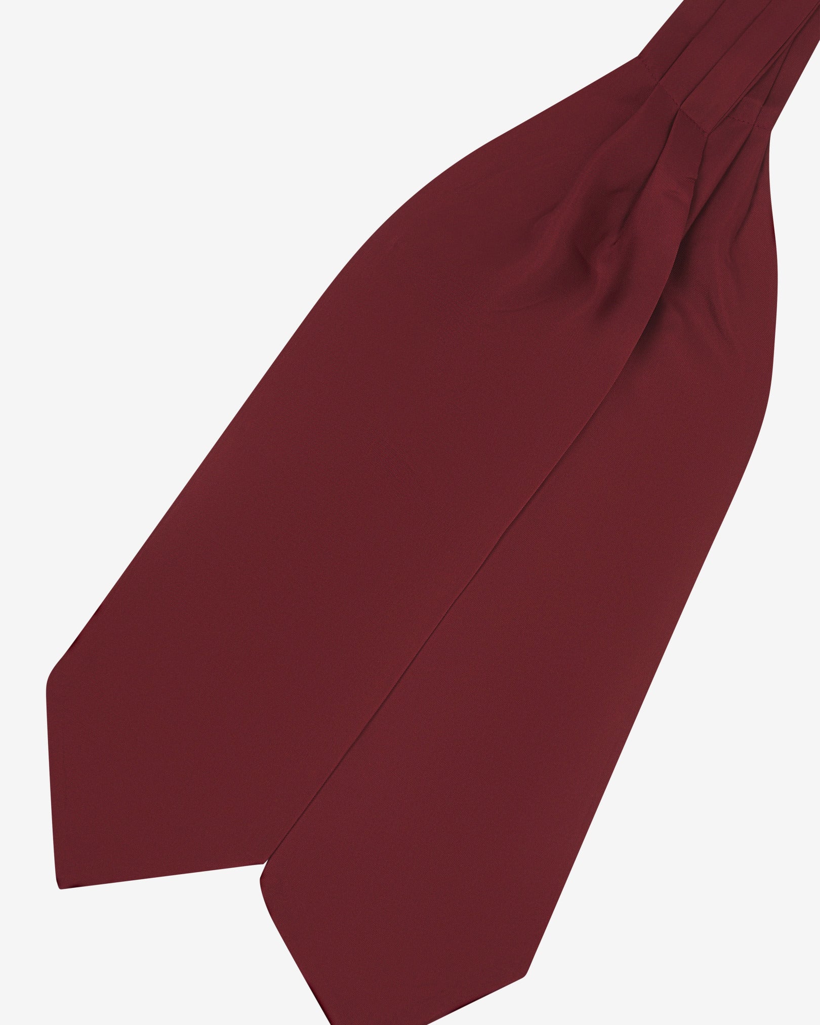 Angled view of the wine-red silk double Ascot or cravat. Presented with wide ends pointing towards the bottom-left and slightly zoomed in to see the fine silk material.