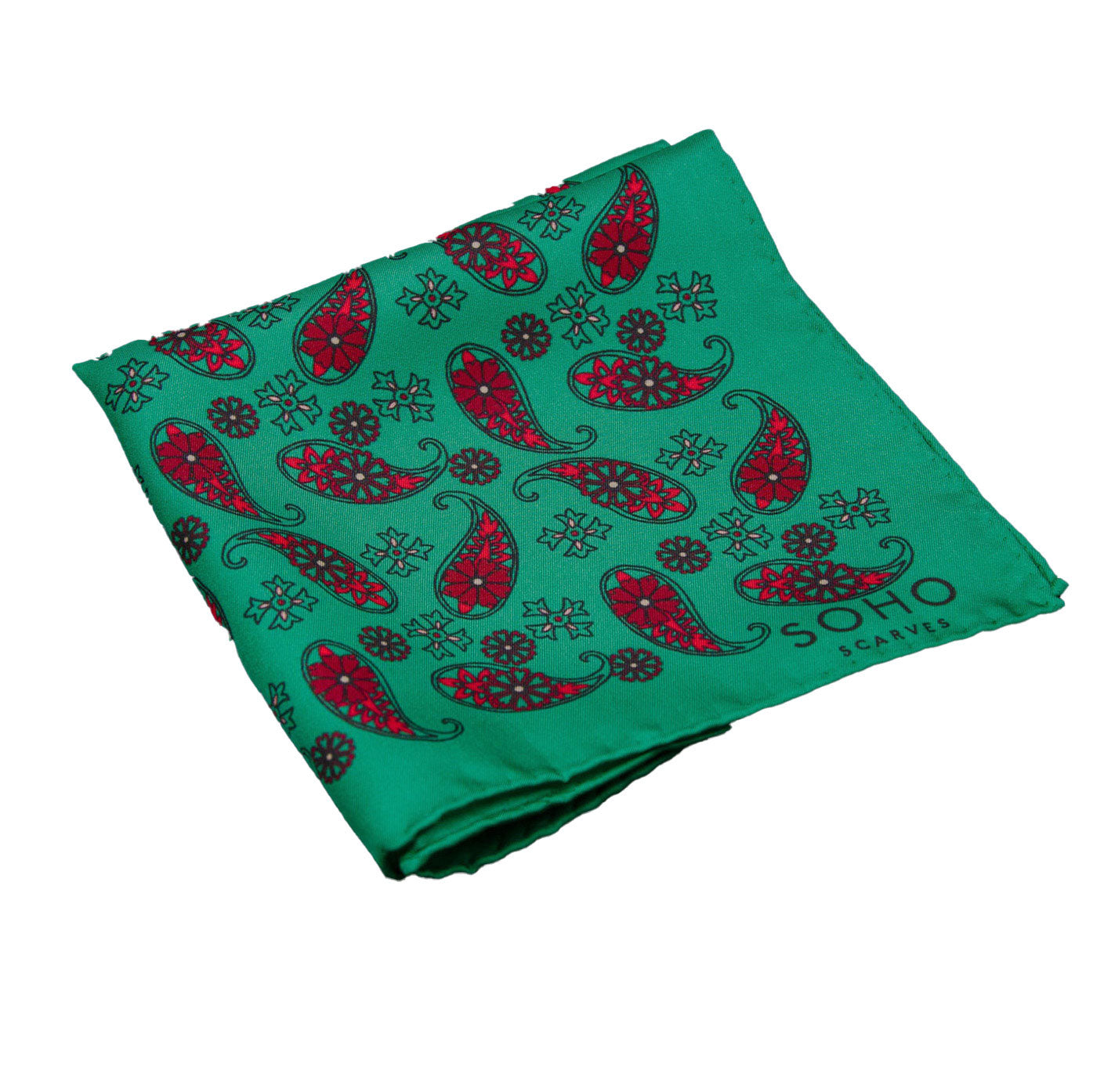 A closer view of silk 'Fes' pocket square folded showing simple red paisley 'tears' on a green ground. Pocket square placed on a white background.