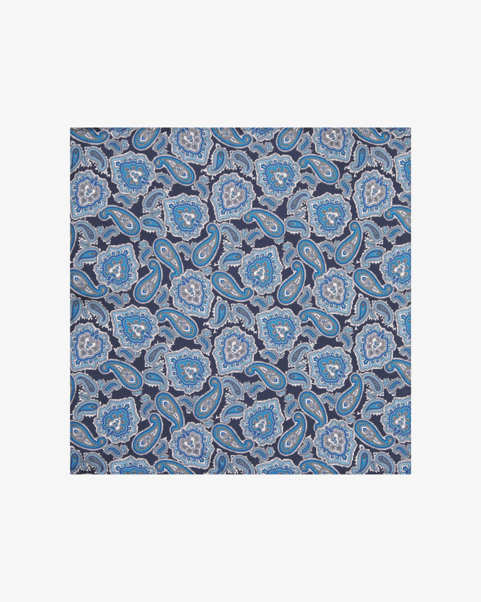 Fully unfolded 'DeZon' silk pocket square, showing the repeated blue paisley patterns enhanced with white and grey accents.