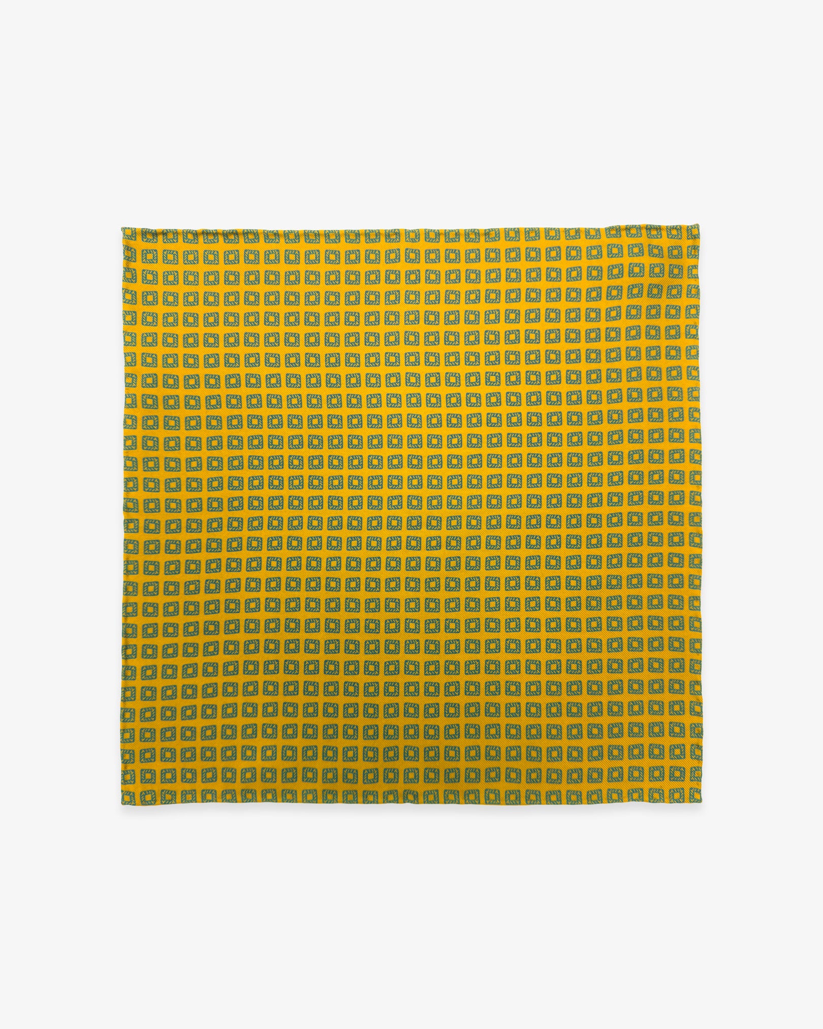 Fully unfolded 'Dover' English silk pocket square, showing the neat rows of blue squares against a golden-yellow background.