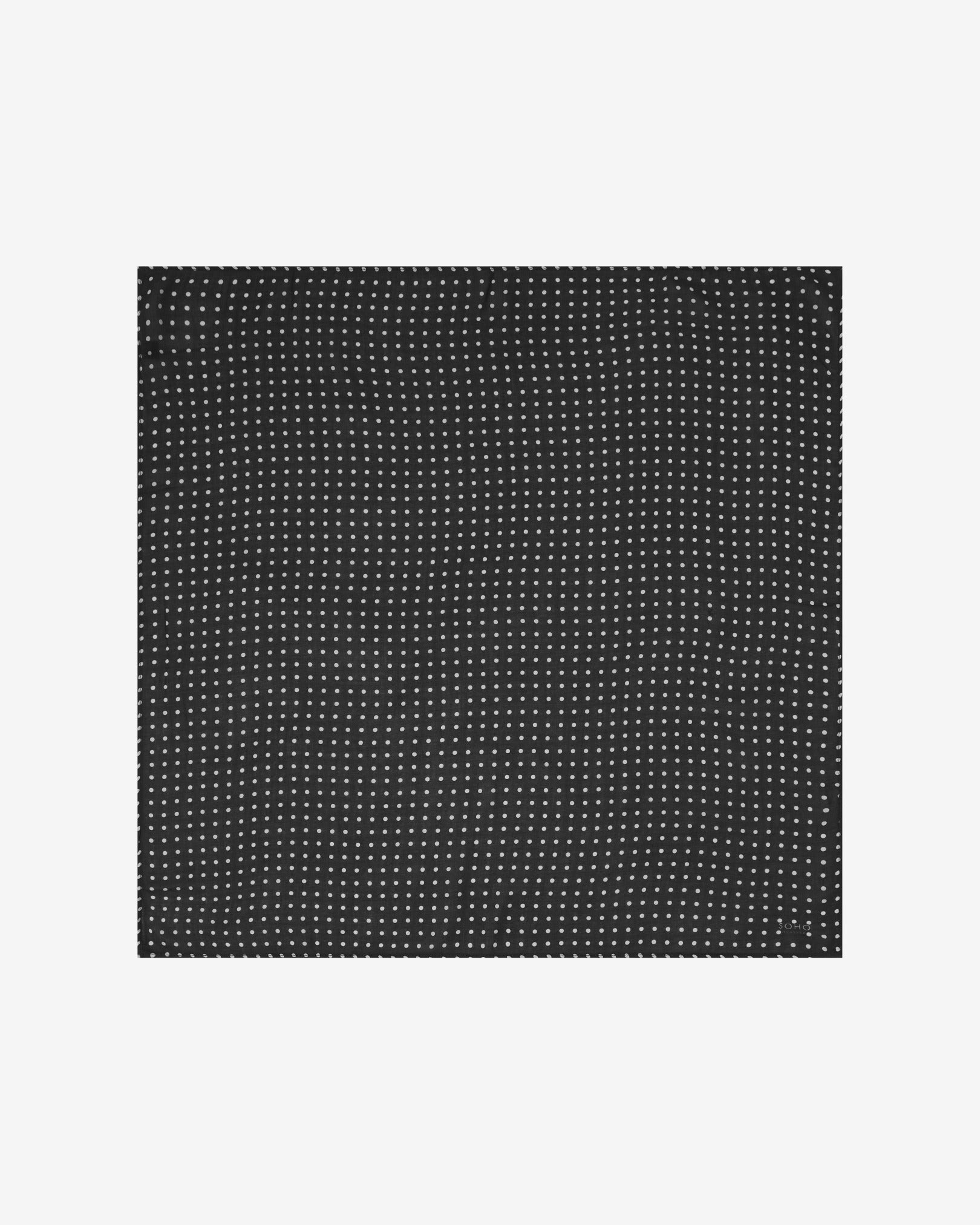 Neatly folded view of 'The Shinagwa' bandana. Showing the repeating polka dot pattern in white against the black background.