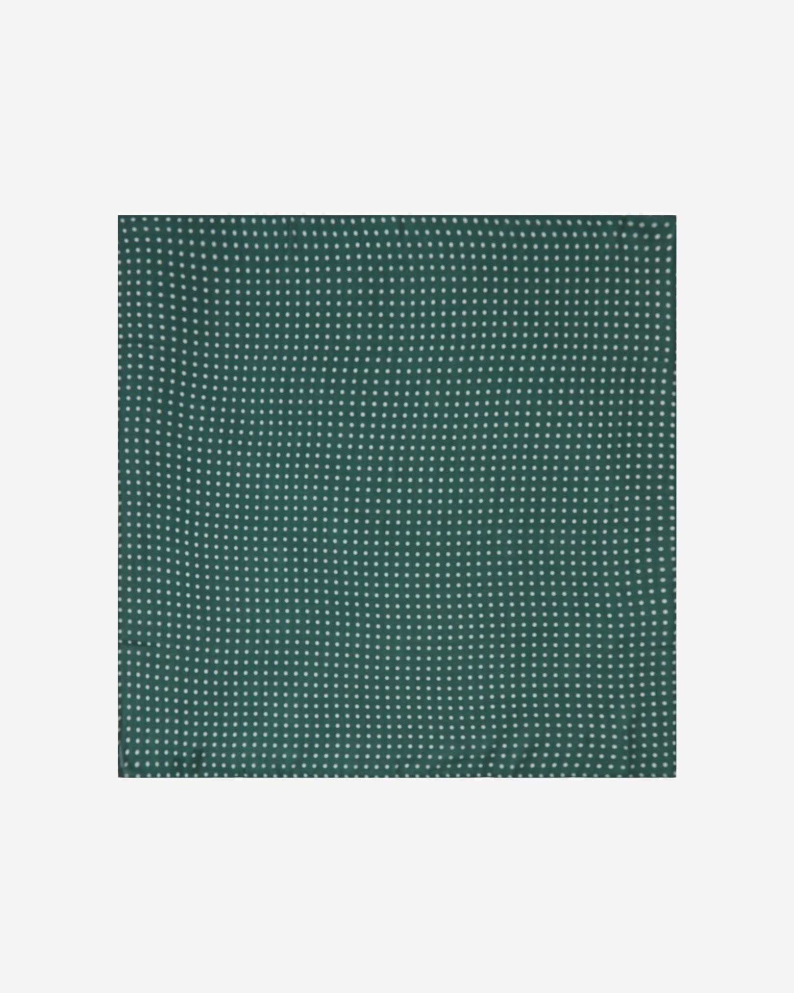 Neatly folded view of 'The Westminster RG' bandana. Showing the repeating polka dot pattern in white against the British racing green background.