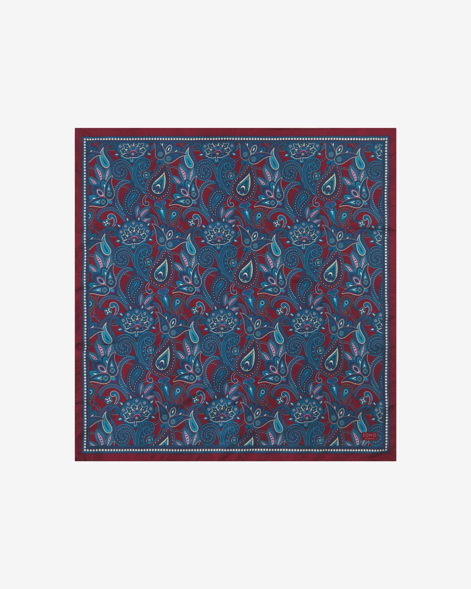 Fully unfolded 'Windermere' silk neckerchief, clearly displaying the blue and blue-green paisley patterns on a rust-red background with matching border.