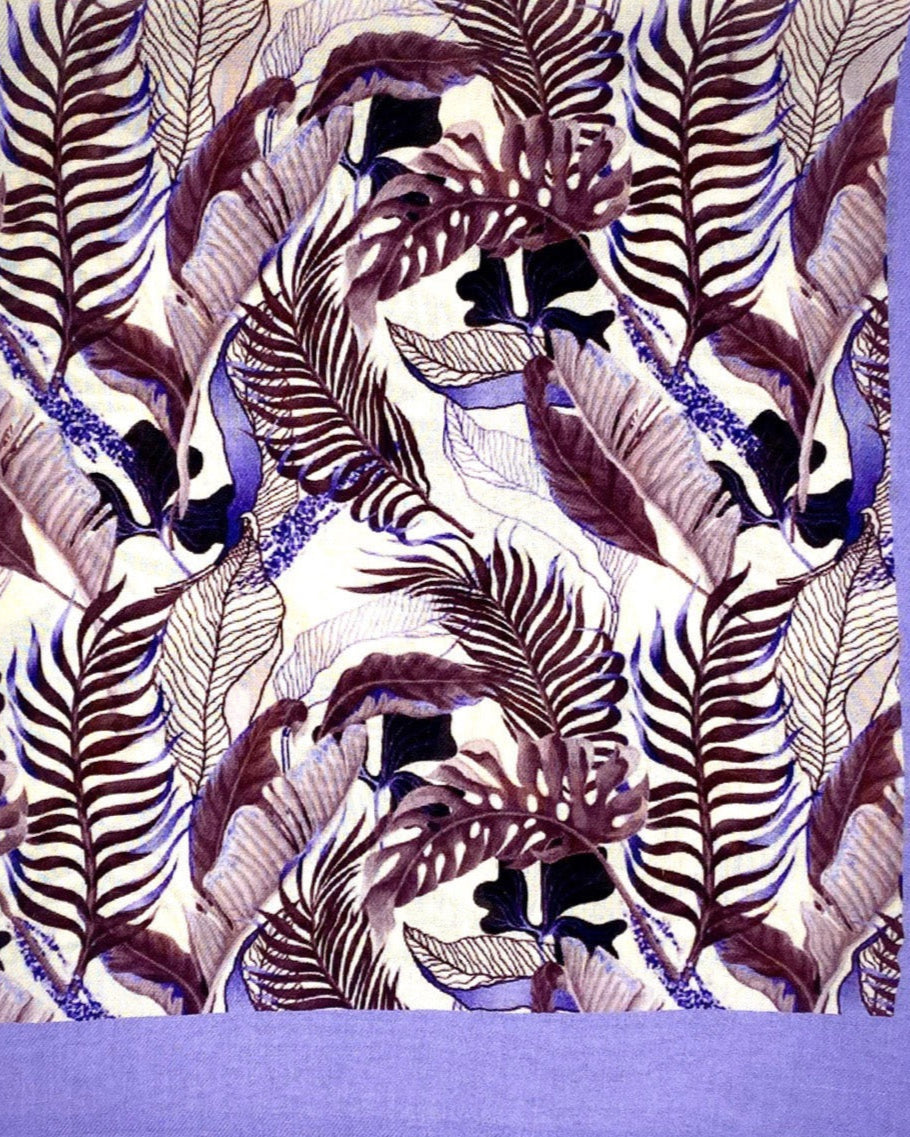 A flat, folded view of 'The Andes' bandana. The pattern is comprised of leaf and foliage shapes in various maroon and purple shades against a violet border.