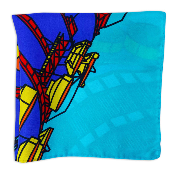 Blue version of the BT Tower multicoloured pattern pocket square folded and arranged in a square shape showing a close-up of the tower motif and blue background.