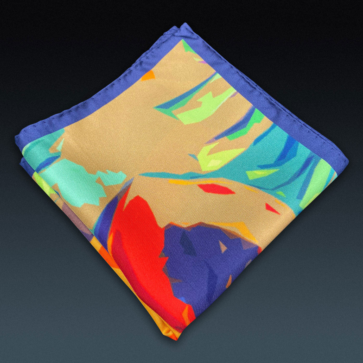 Folded 'Derwent' silk pocket square from SOHO Scarves, showing the striking tropical pattern on a dark background.