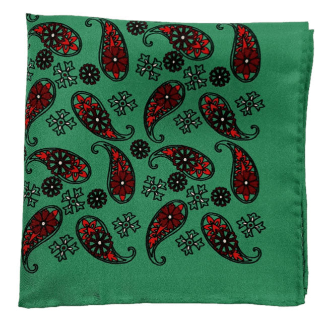 Pure silk 'Fes' pocket square folded into a quarter, showing red paisley 'tears' interdispersed with decorative floral patterns on a vibrant green ground.