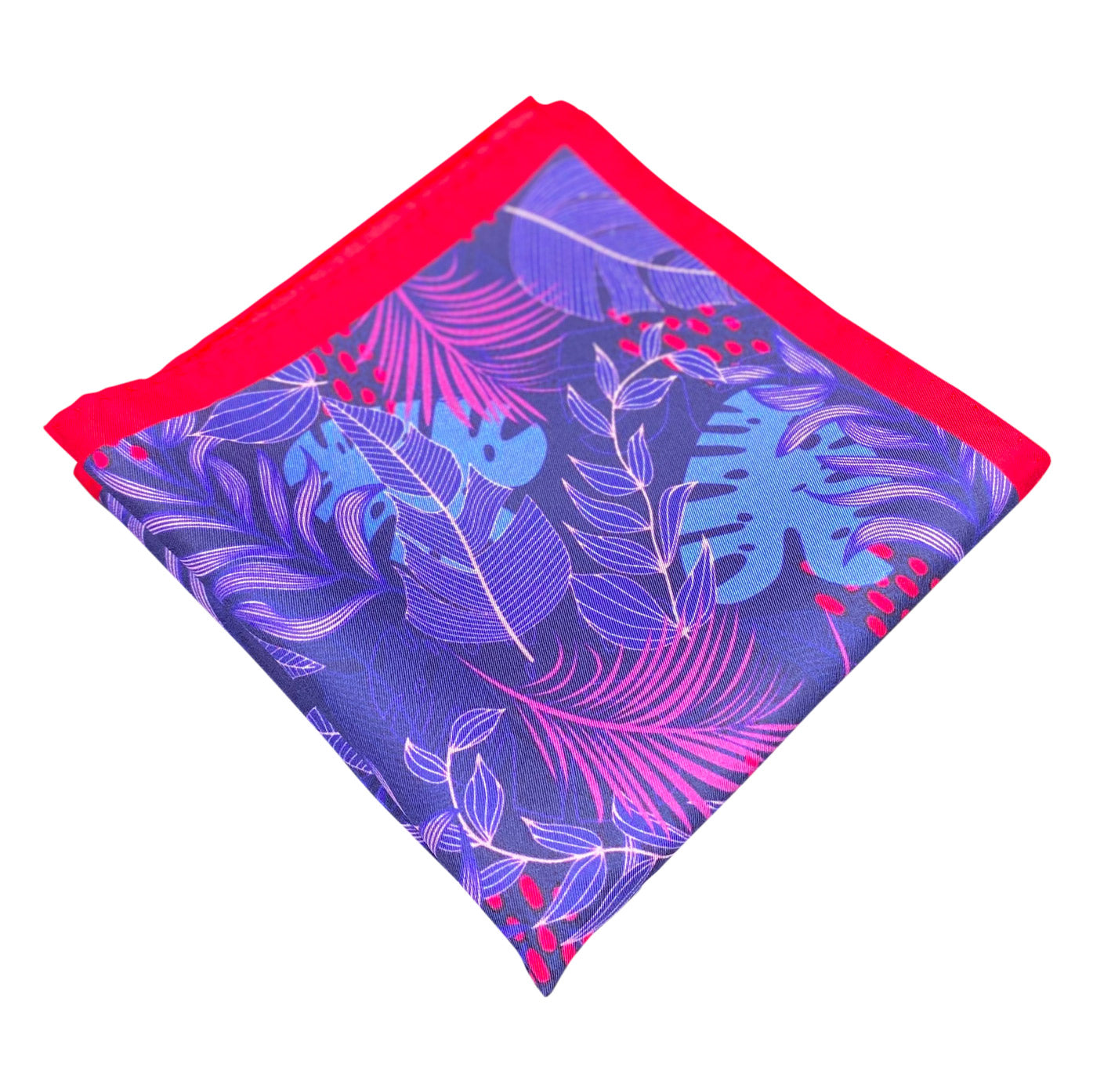 Folded 'Mersey' silk pocket square from SOHO Scarves, showing the blue and pink leaf patterns. Placed on a light background.