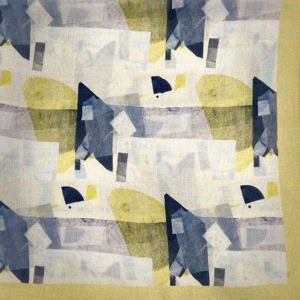 A flat, folded view of 'The Nevada' bandana. The pattern shows the abstract angular and curved shapes in various cream and blue-grey tones, neatly framed with a muted yellow background.